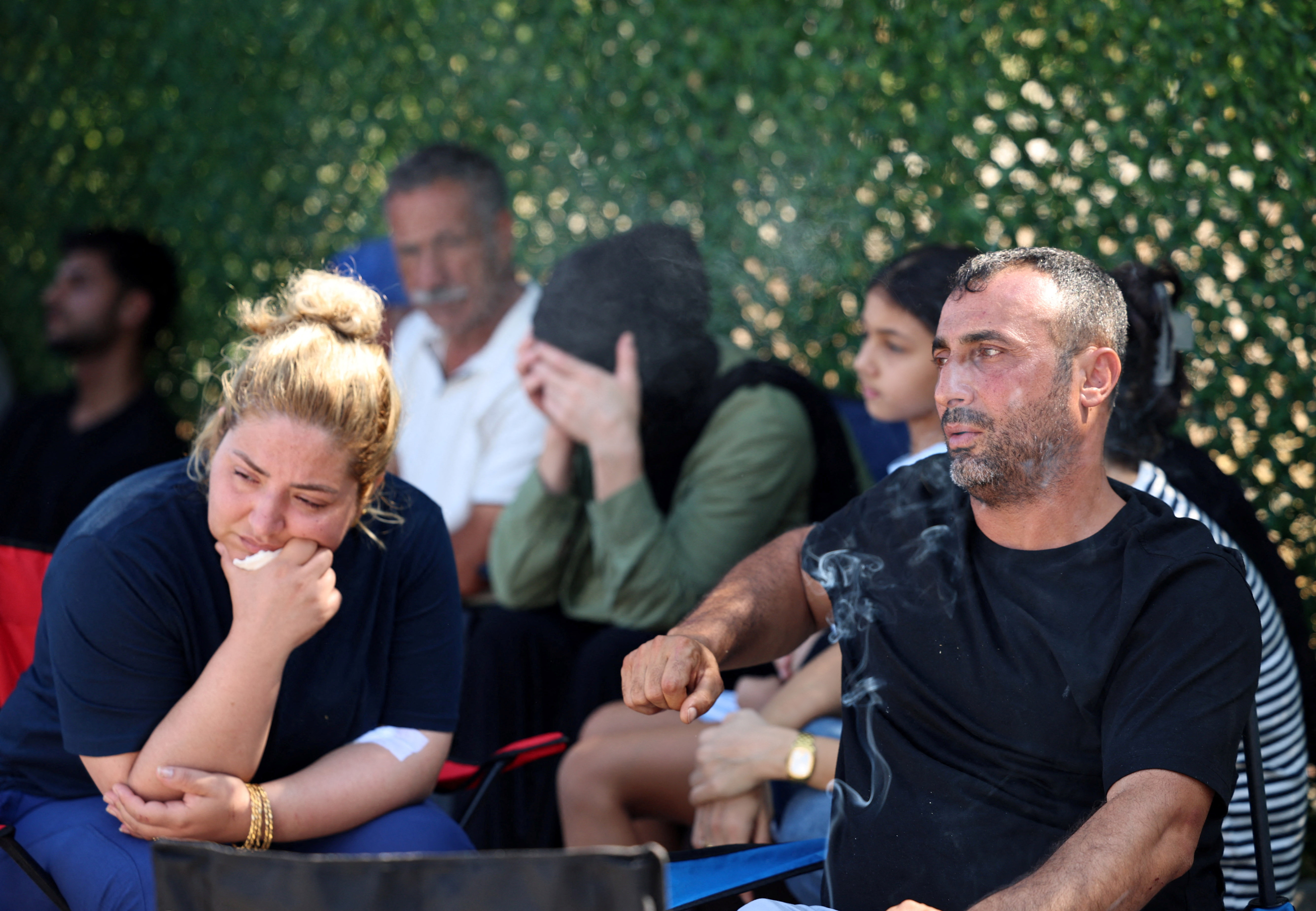 Ayten Bicer and Hayri Bicer, whose two children are missing after a passenger boat capsized off the coast of Kyrenia, wait for an update outside Kyrenia port, in Turkish-controlled northern Cyprus, August 31, 2026. REUTERS/Yiannis Kourtoglou