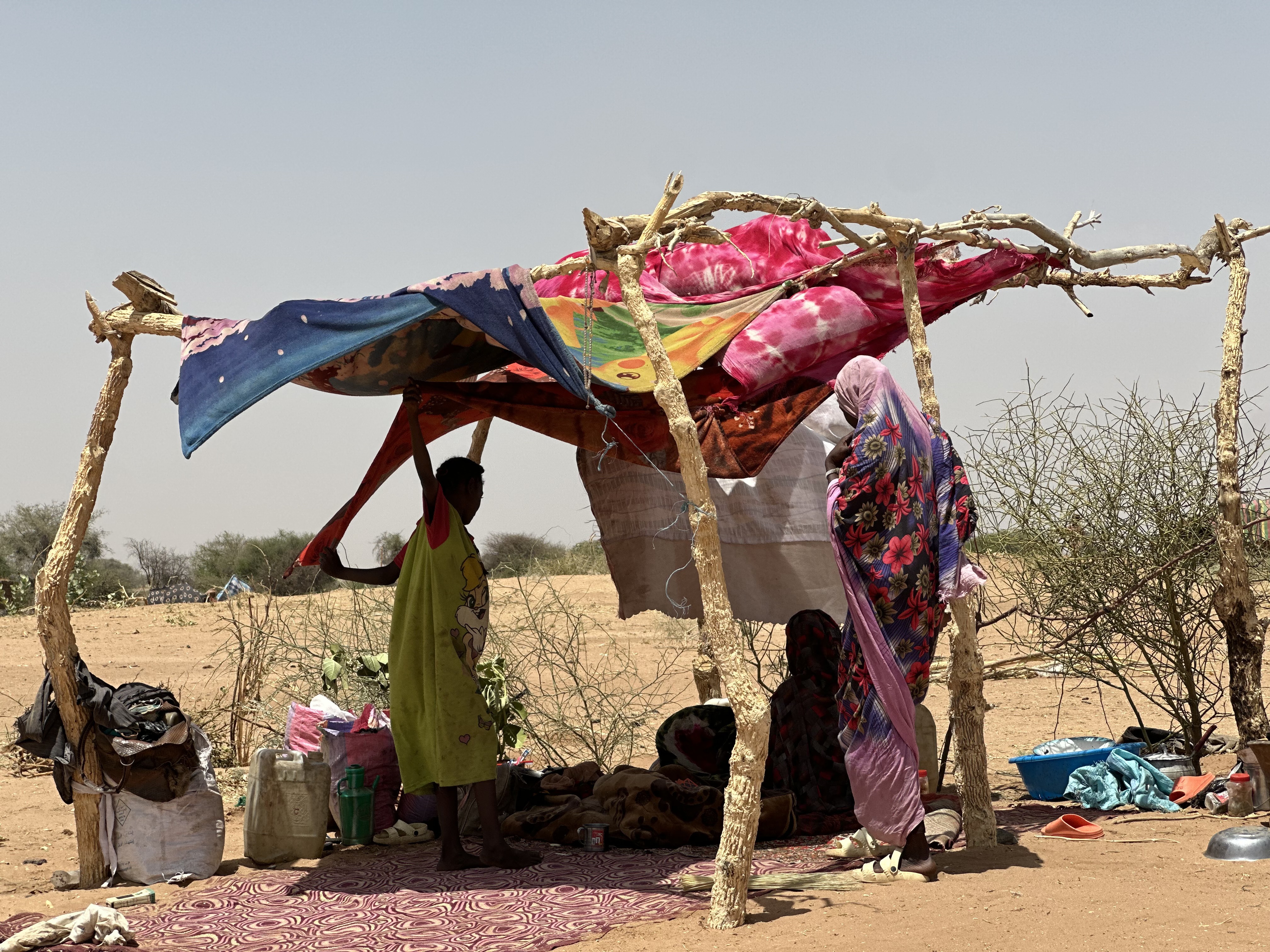 Sudanese people, who fled from the internally displaced persons (IDP) Zamzam camp, rest while on their way to the Tawila Camps amid the ongoing conflict between Sudan's army and the Rapid Support Forces (RSF), in North Darfur, Sudan, 23 April 2025. The RSF claimed control of the Zamzam camp after its assault in April 2025. According to the UNHCR, over four million people have fled Sudan to neighboring countries since the outbreak of the armed conflict in April 2023. EPA/MARWAN MOHAMED