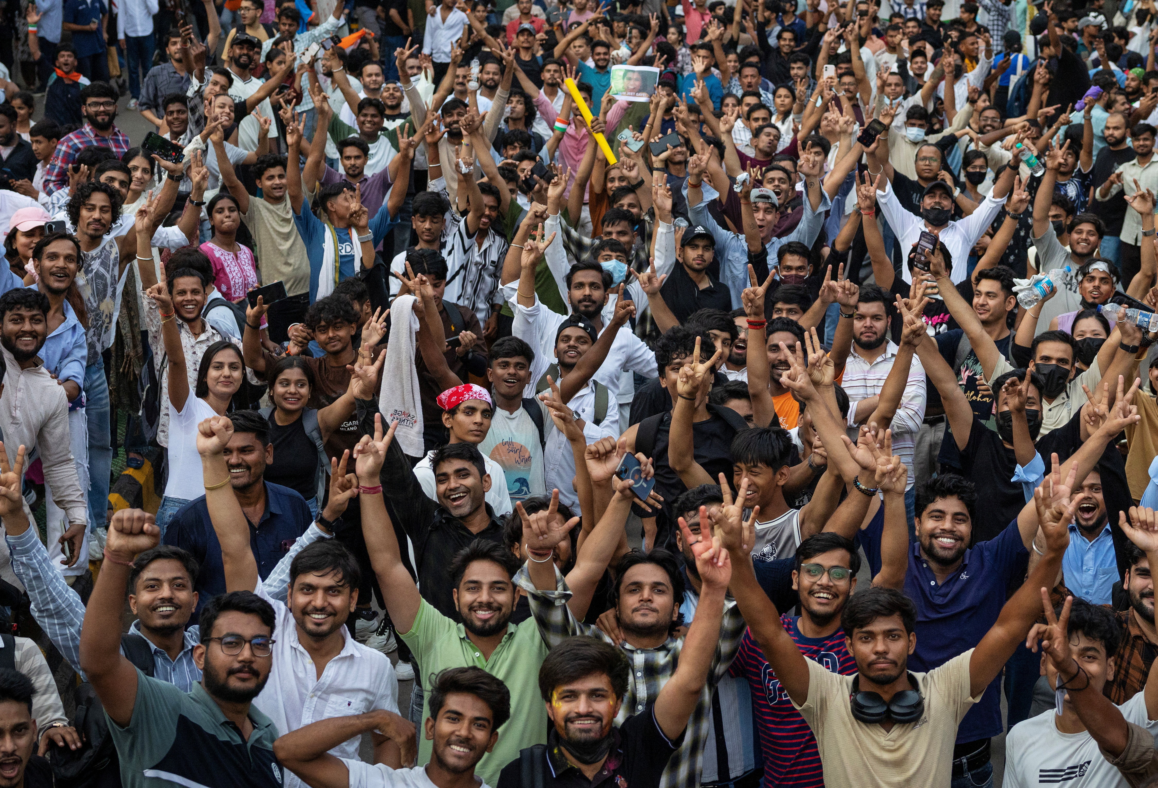 Supporters of India's Cockroach Janta Party (CJP) celebrate after India's Education Minister Dharmendra Pradhan resigned following days of protests demanding his resignation over National Eligibility cum Entrance Test (NEET) examination paper leaks, in New Delhi, India, July 25, 2026. REUTERS/Adnan Abidi