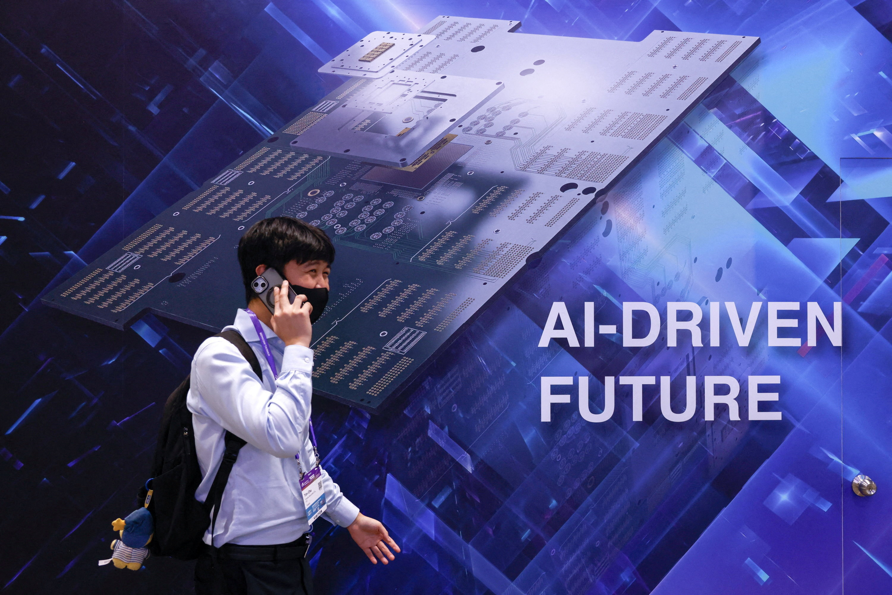 A visitor walks past a display reading "AI-DRIVEN FUTURE" during SEMICON Taiwan in Taipei, Taiwan, September 2, 2026. REUTERS/Ann Wang TPX IMAGES OF THE DAY