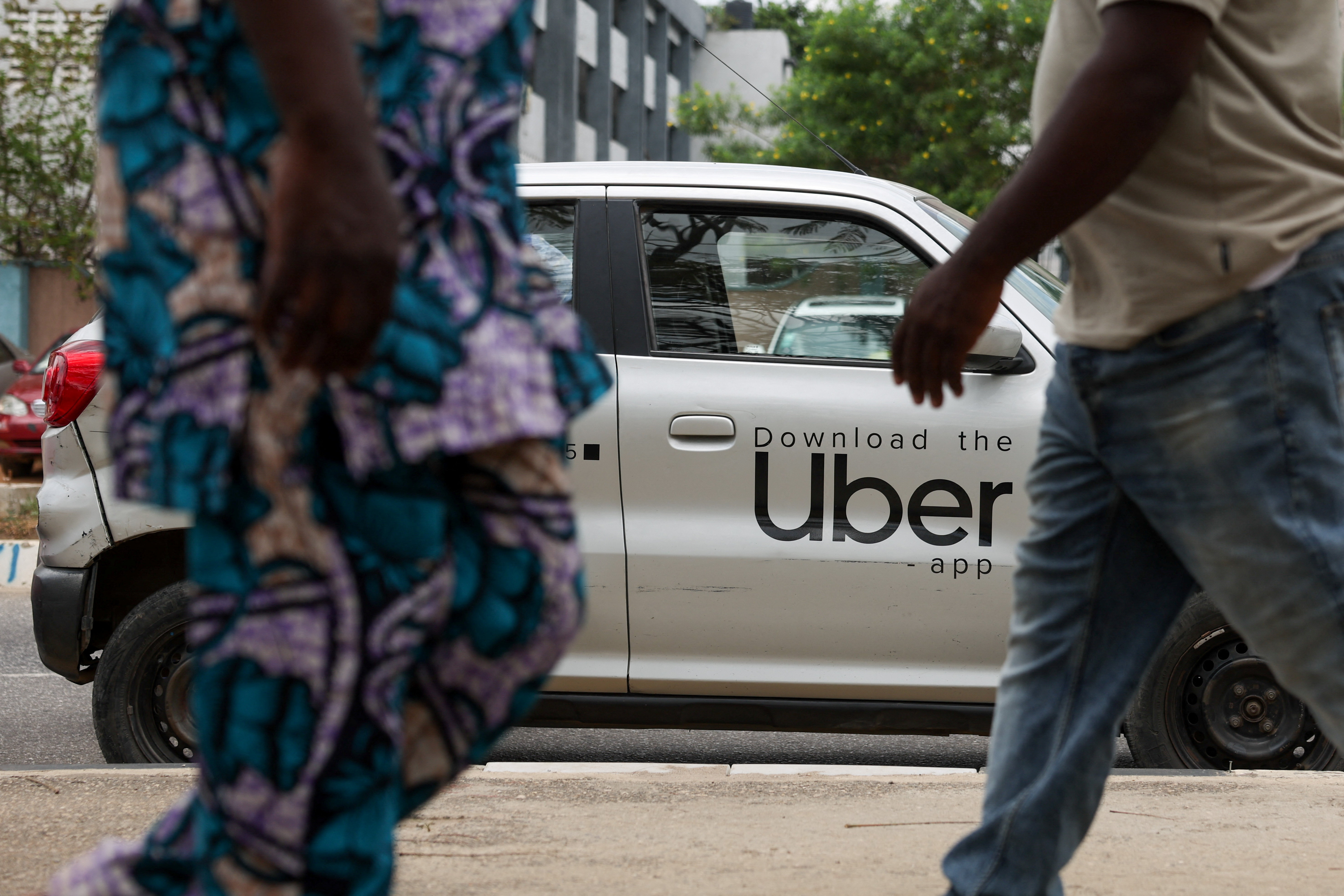 An Uber car is parked in Nigeria, where rising fuel and vehicle-maintenance costs are putting pressure on ride-hailing drivers and the platforms they work for [Sodiq Adelakun/Reuters]