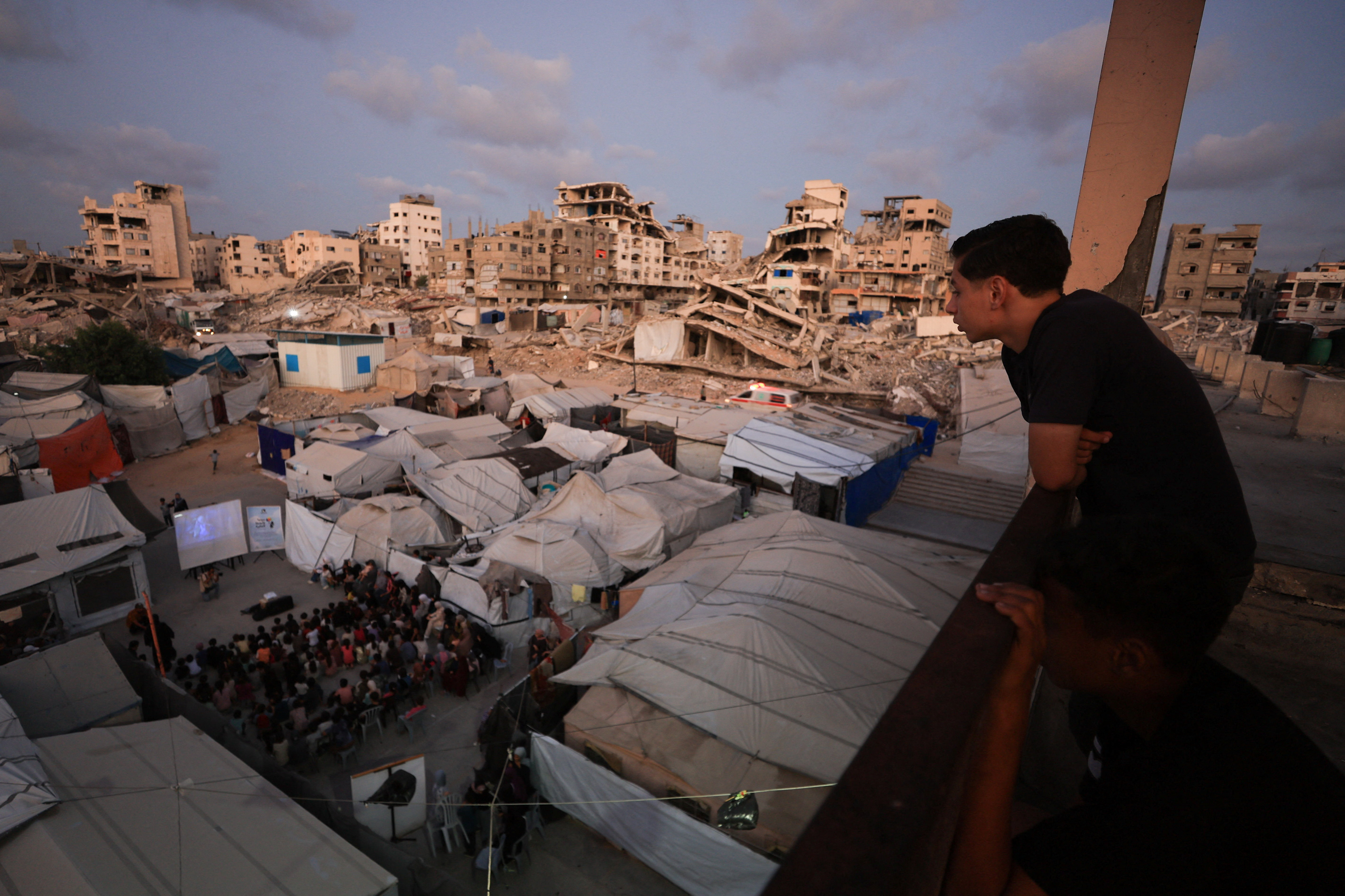 Man overlooks rubble