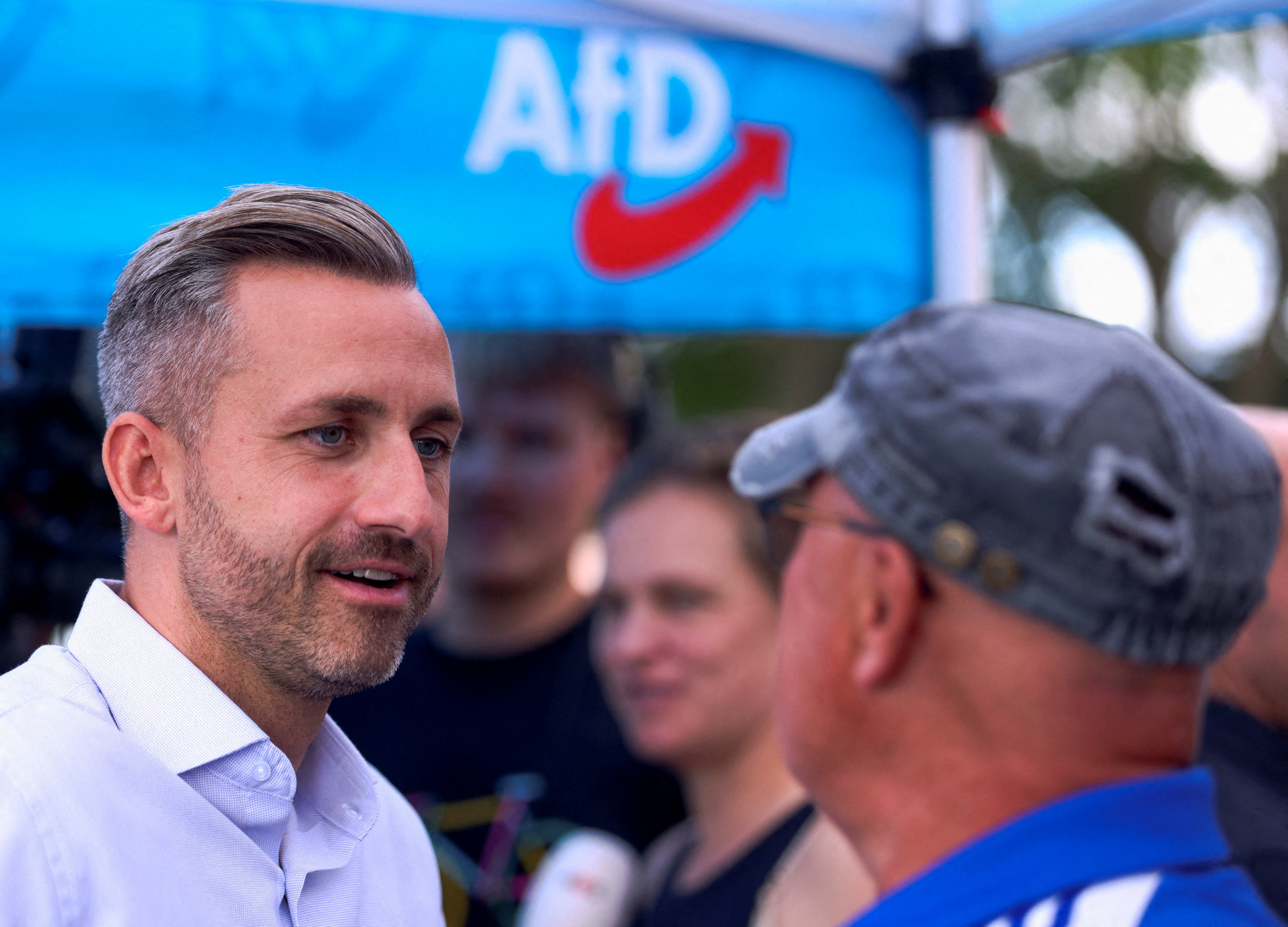 Ulrich Siegmund, top candidate of the far-right Alternative for Germany (AfD) party, talks to supporters.