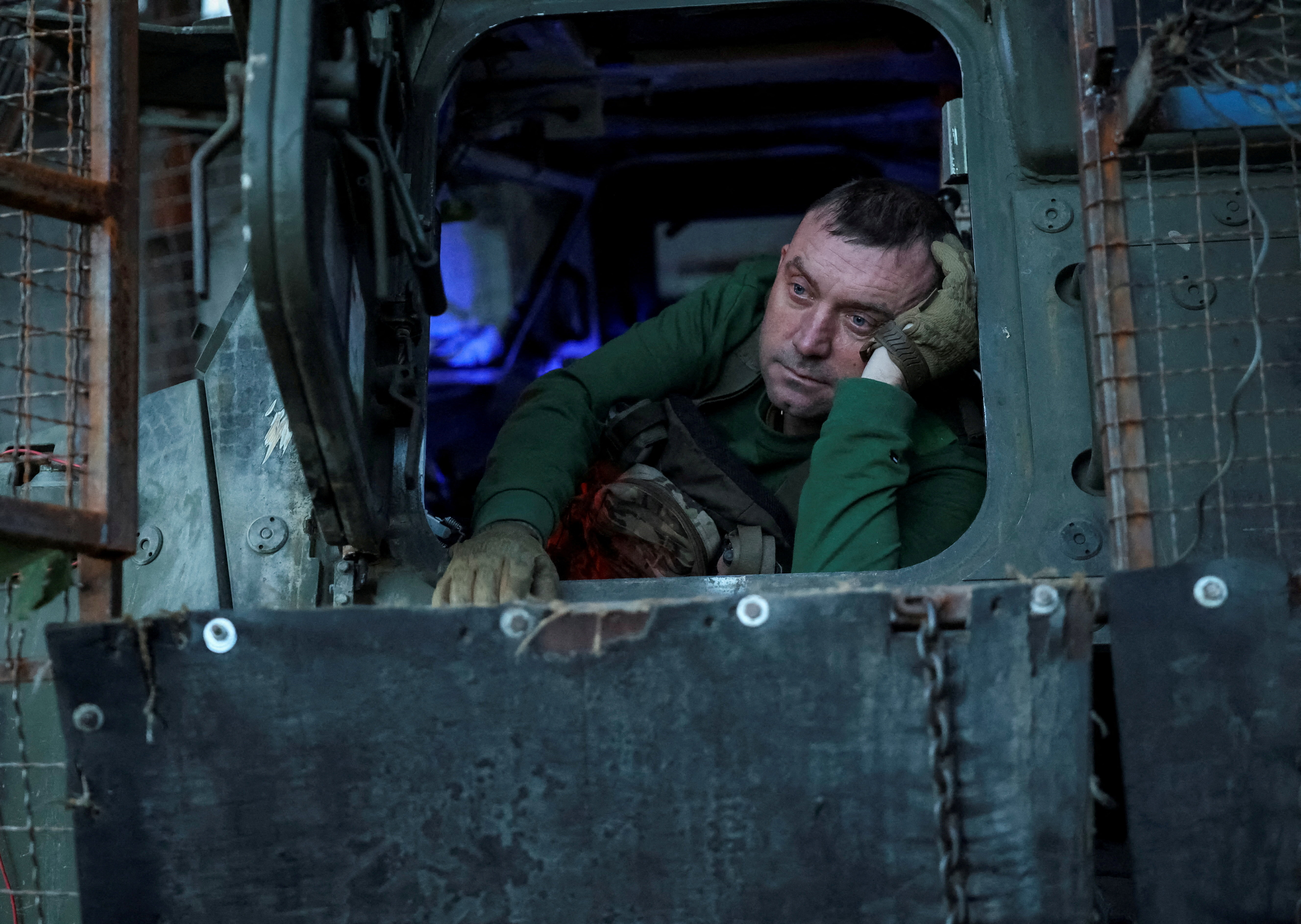 A serviceman of the 24th Separate Mechanized Brigade of the Ukrainian Armed Forces sits in a military vehicle at his positions, amid Russia's attack on Ukraine, in Donetsk region, Ukraine, September 9, 2026. REUTERS/Anatolii Stepanov REFILE - UPDATING TO FIX TYPO IN "SETS" TO "SITS". TPX IMAGES OF THE DAY
