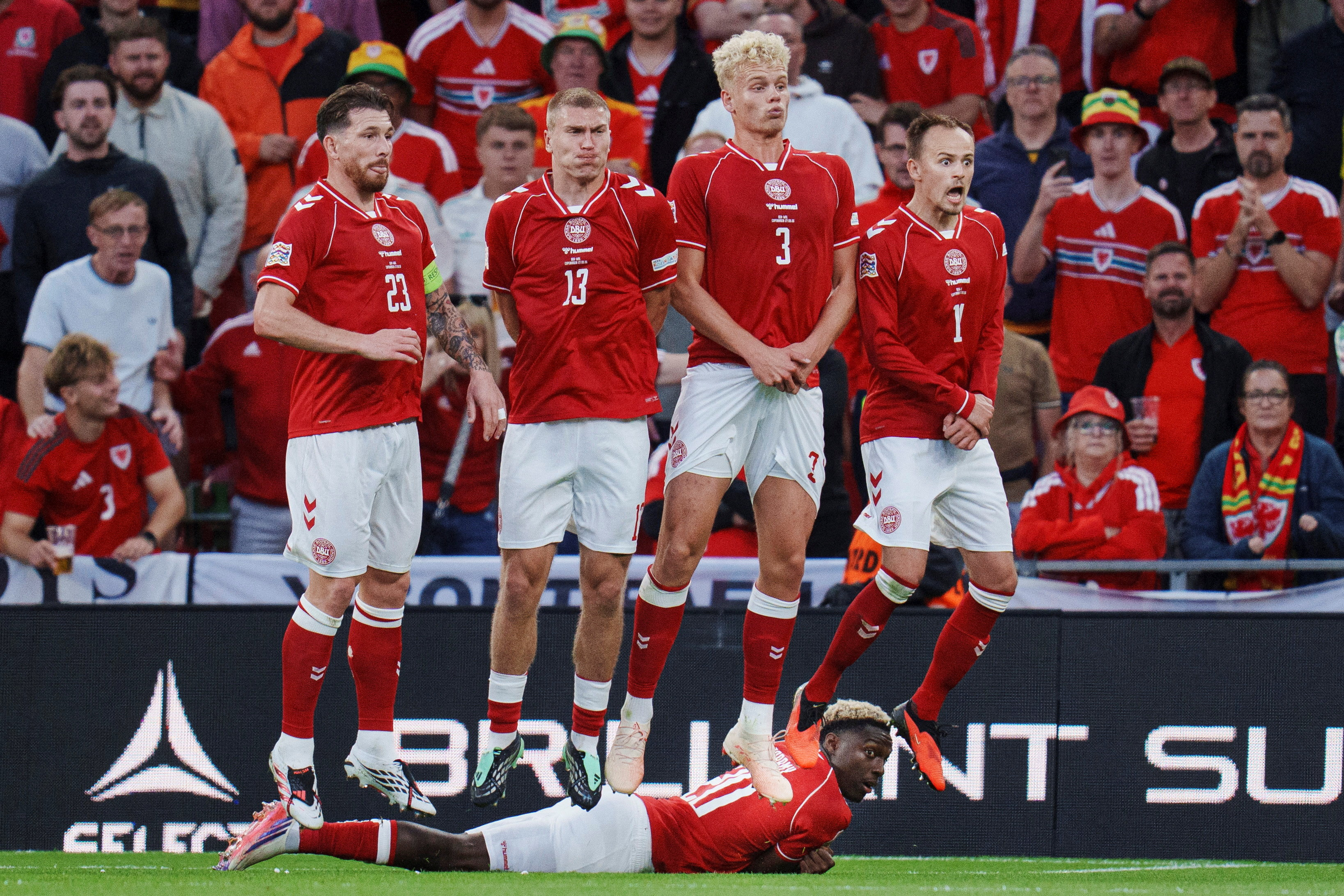 Soccer Football - Nations League - Group A4 - Denmark v Wales - Parken, Copenhagen, Denmark - September 27, 2026 Denmark's Pierre-Emile Hoejbjerg, Rasmus Kristensen, Oliver Provstgaard, Mikkel Damsgaard and Mohamed Daramy defend a free-kick Liselotte Sabroe/Ritzau Scanpix via REUTERS ATTENTION EDITORS - THIS IMAGE WAS PROVIDED BY A THIRD PARTY. DENMARK OUT. NO COMMERCIAL OR EDITORIAL SALES IN DENMARK.