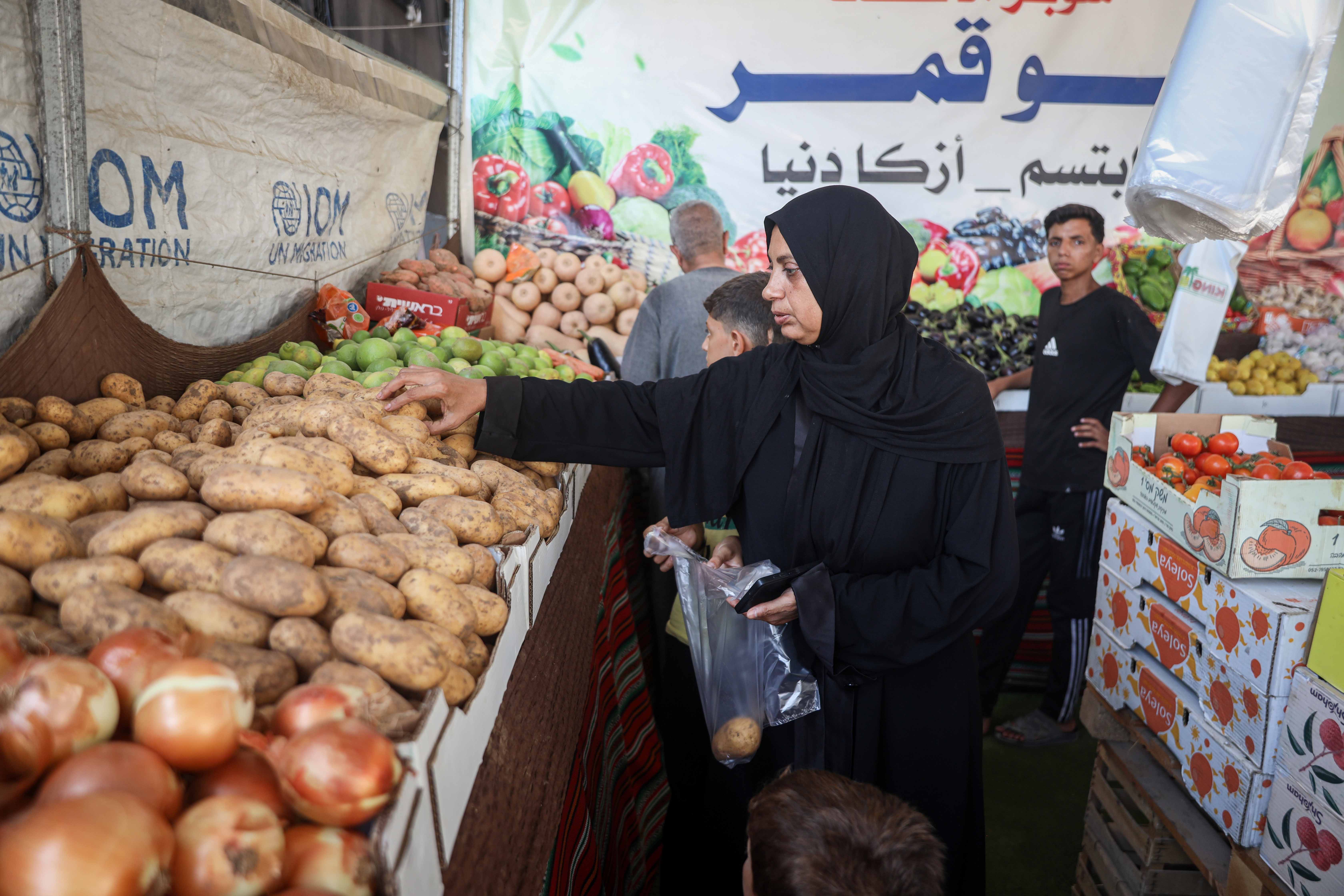 Fresh vegetables are increasingly difficult for Mervat to afford, but she tries to include them in the children’s meals to keep their diet varied [Abdelhakim Abu Riash/Al Jazeera]