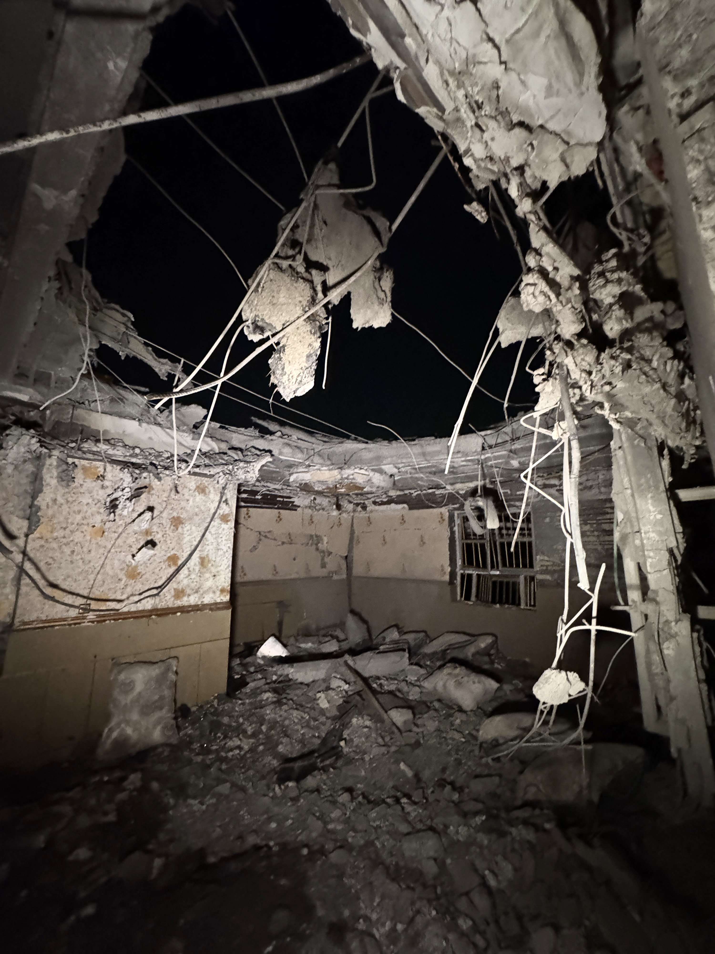 In this picture obtained by AFP from the Iranian news agency Tasnim on September 2, 2026 a destroyed building is pictured at the site of an overnight strike in Kuhestak, Sirik County, in Iran's southern Hormozgan province on September 2, 2026. Iranian forces said on September 2 that they launched attacks on US military targets in the United Arab Emirates, Kuwait, Bahrain and other countries in the region, vowing "severe" consequences for renewed American attacks on the Islamic republic. (Photo by Masoud Mohamadi / TASNIM NEWS / AFP) /