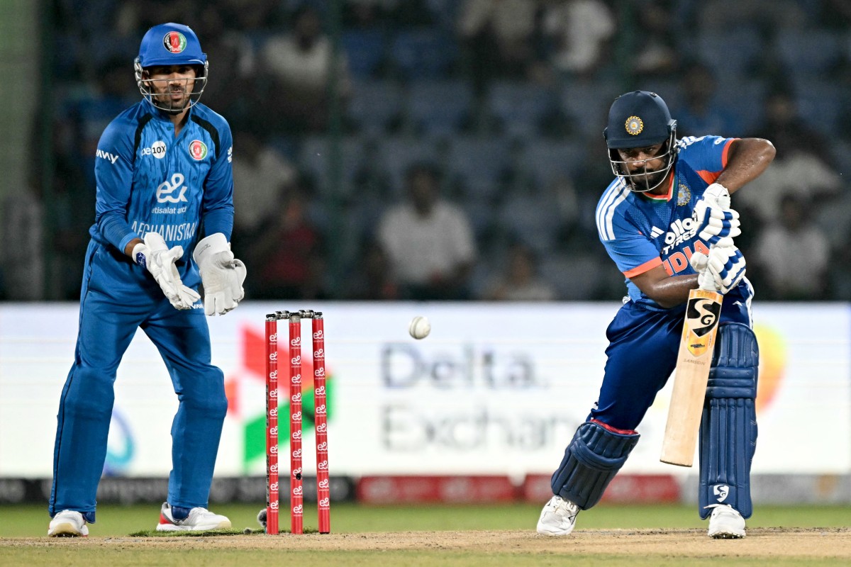 India's Sanju Samson (R) plays a shot as Afghanistan's wicketkeeper Rahmanullah Gurbaz fields