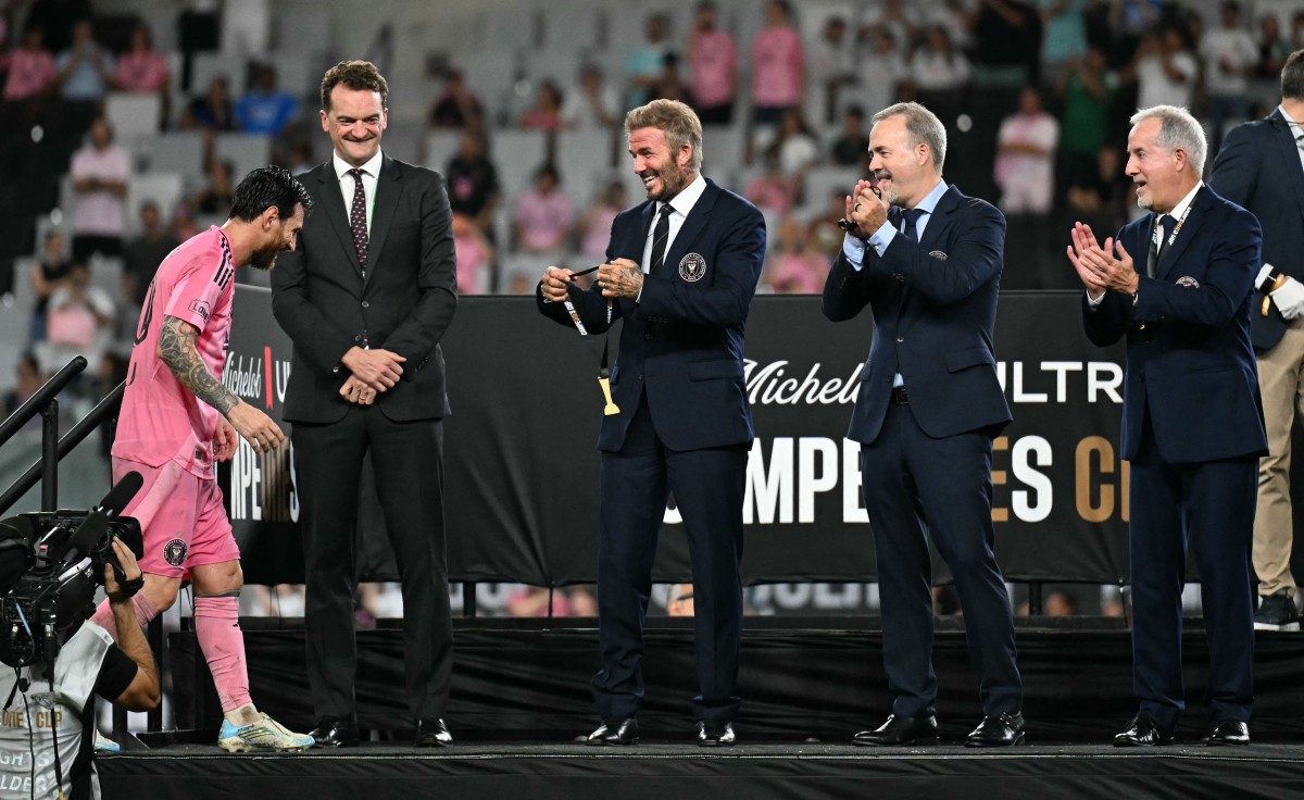 Inter Miami's co-owners David Beckham (3R), Jorge Mas (2R) and Jose Mas (R) cheer as Argentine forward #10 Lionel Messi walks to receive his medal after their team defeated Mexico's Cruz Azul in the Campeones Cup final at Nu Stadium in Miami, Florida