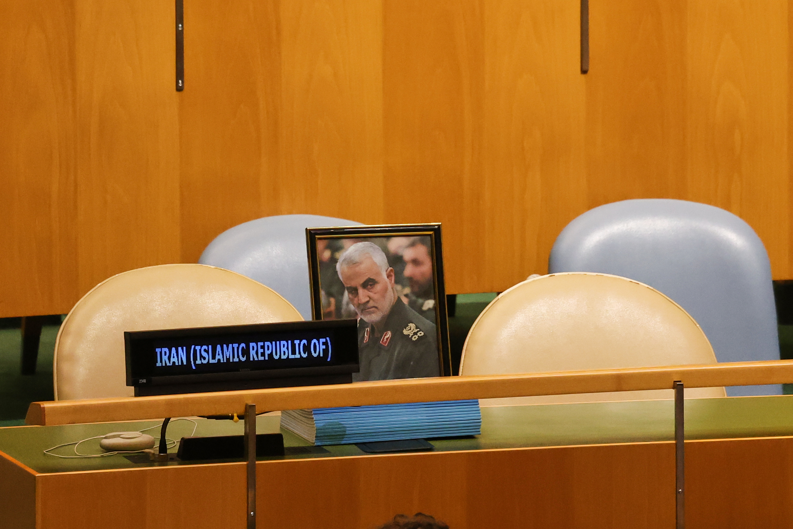 A photo of the late Qasem Soleimani is displayed as chairs for delegates from Iran are unoccupied while Israeli Prime Minister Benjamin Netanyahu speaks during the 81st session of the United Nations General Assembly at United Nations headquarters, Thursday, Sept. 24, 2026. [Heather Khalifa/AP Photo]