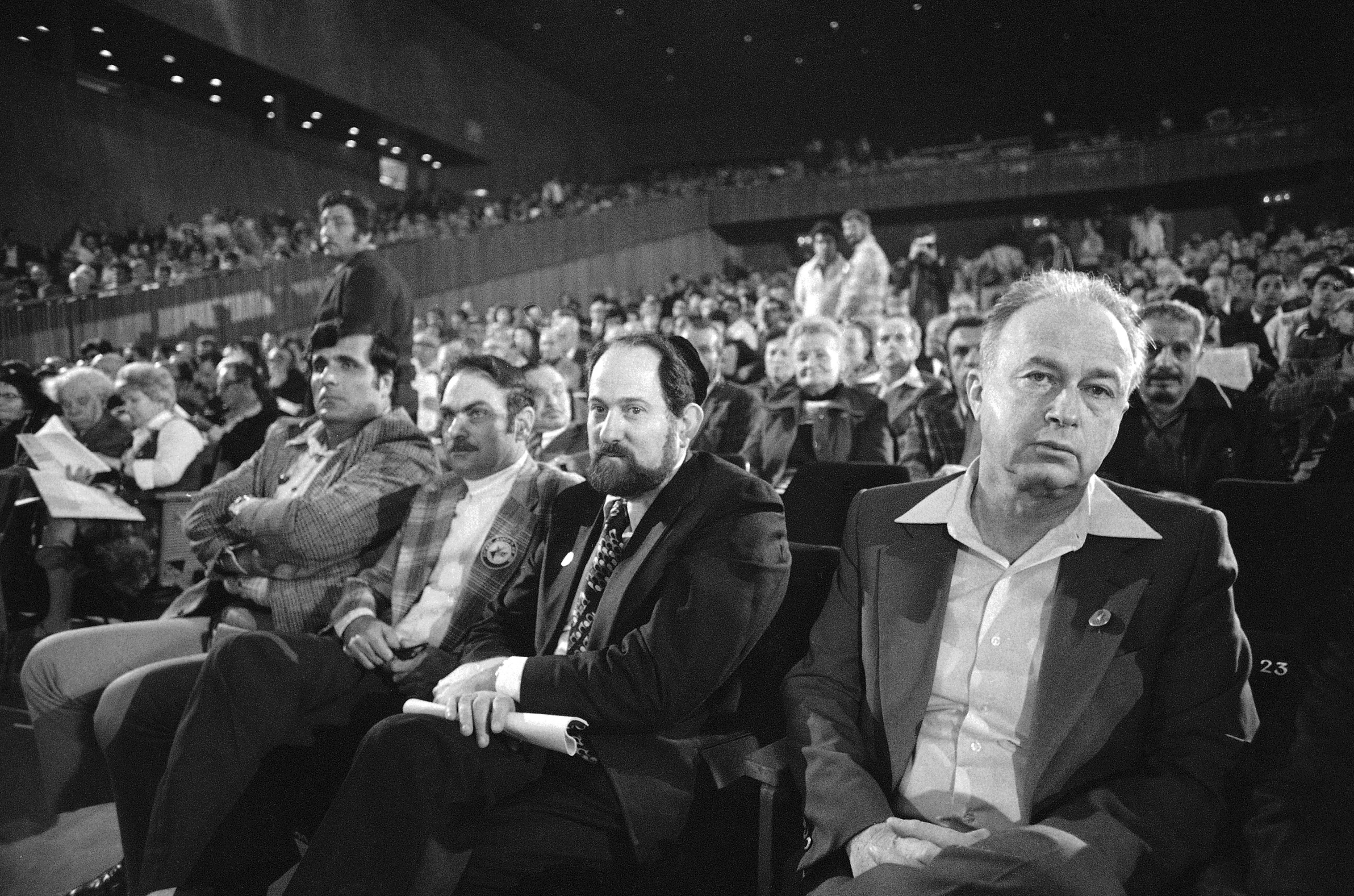 Israeli Prime Minister Yitzhak Rabin (right) listens with other delegates as Labor party convention met in Tel Aviv Feb. 23, 1977. Delegates will choose between Rabin and Defense Minister Shimon Peres as the party's candidate for Prime Minister in May elections. (AP Photo/Max Nash)