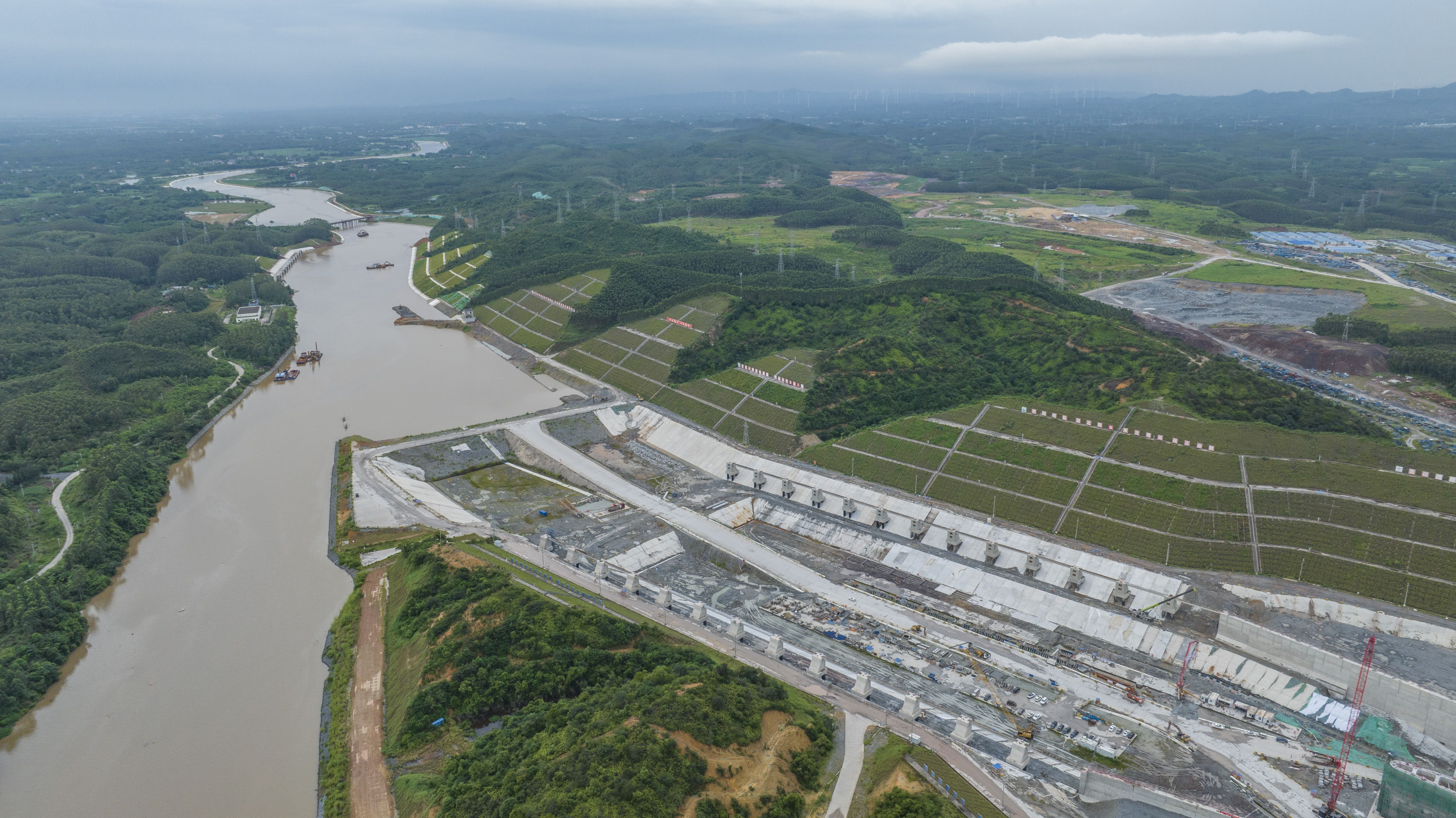QINZHOU, CHINA - AUGUST 16 2025: Aerial view of the Qingnian Ship Lock of the 135-kilometer Pinglu Canal under construction in Qinzhou, south China's Guangxi Zhuang Autonomous Region, Saturday, Aug. 16, 2025. Designed to accommodate 5,000-ton-class vessels through three ship locks, the massive project will link the Xi River with the Beibu Gulf to create a new inlandsea waterway and reduce cargo transport costs. (Photo credit should read PENG HUAN / Feature China/Future Publishing via Getty Images)