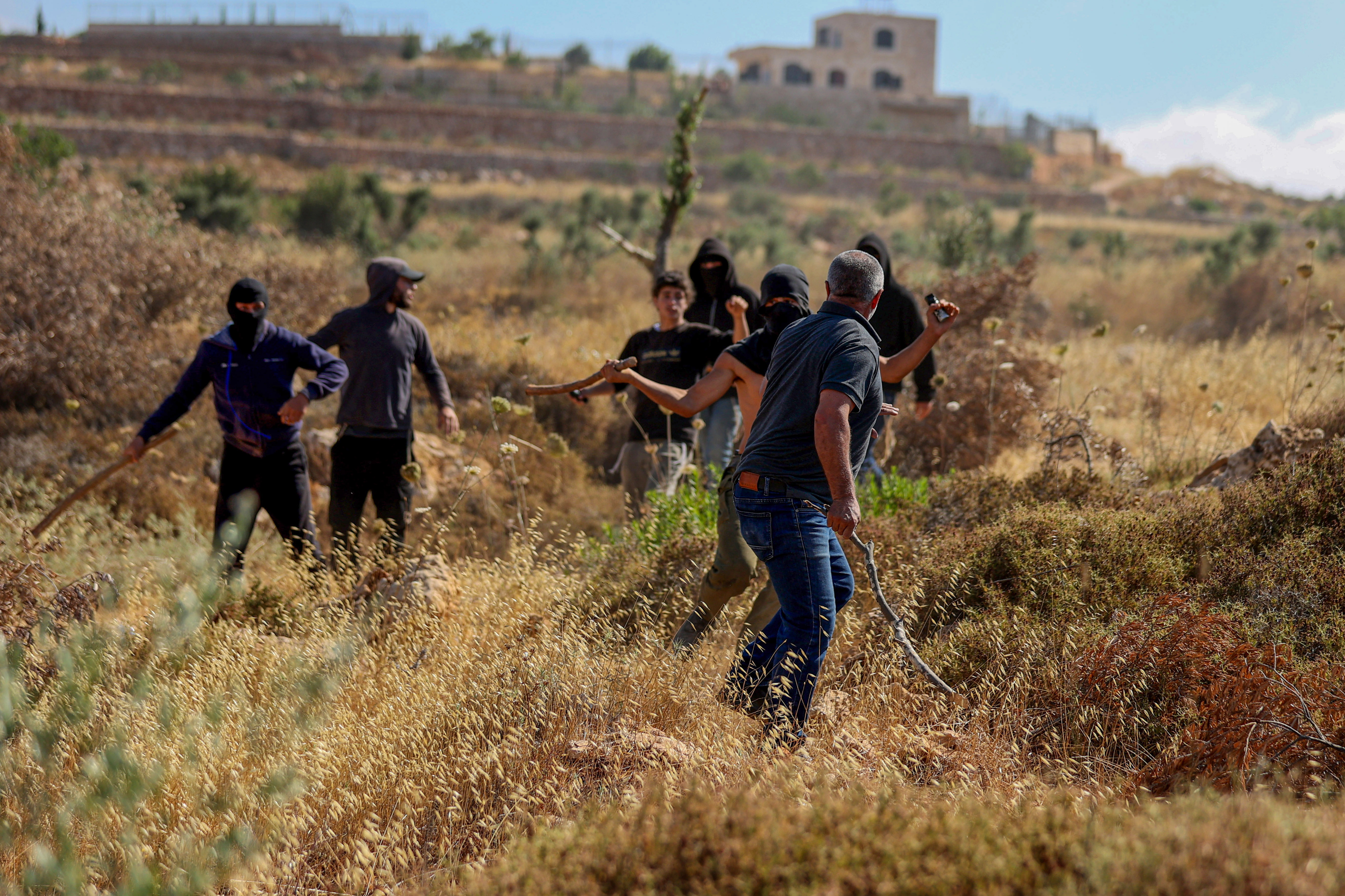 RAMALLAH, WEST BANK, PALESTINE - JULY 3, 2026: Israeli settlers attack Palestinians and foreign activists in Abu Falah, north of Ramallah, as they attempt to access agricultural land. Two Palestinians and several activists were injured. (Photo by Issam Rimawi/Anadolu via Getty Images)