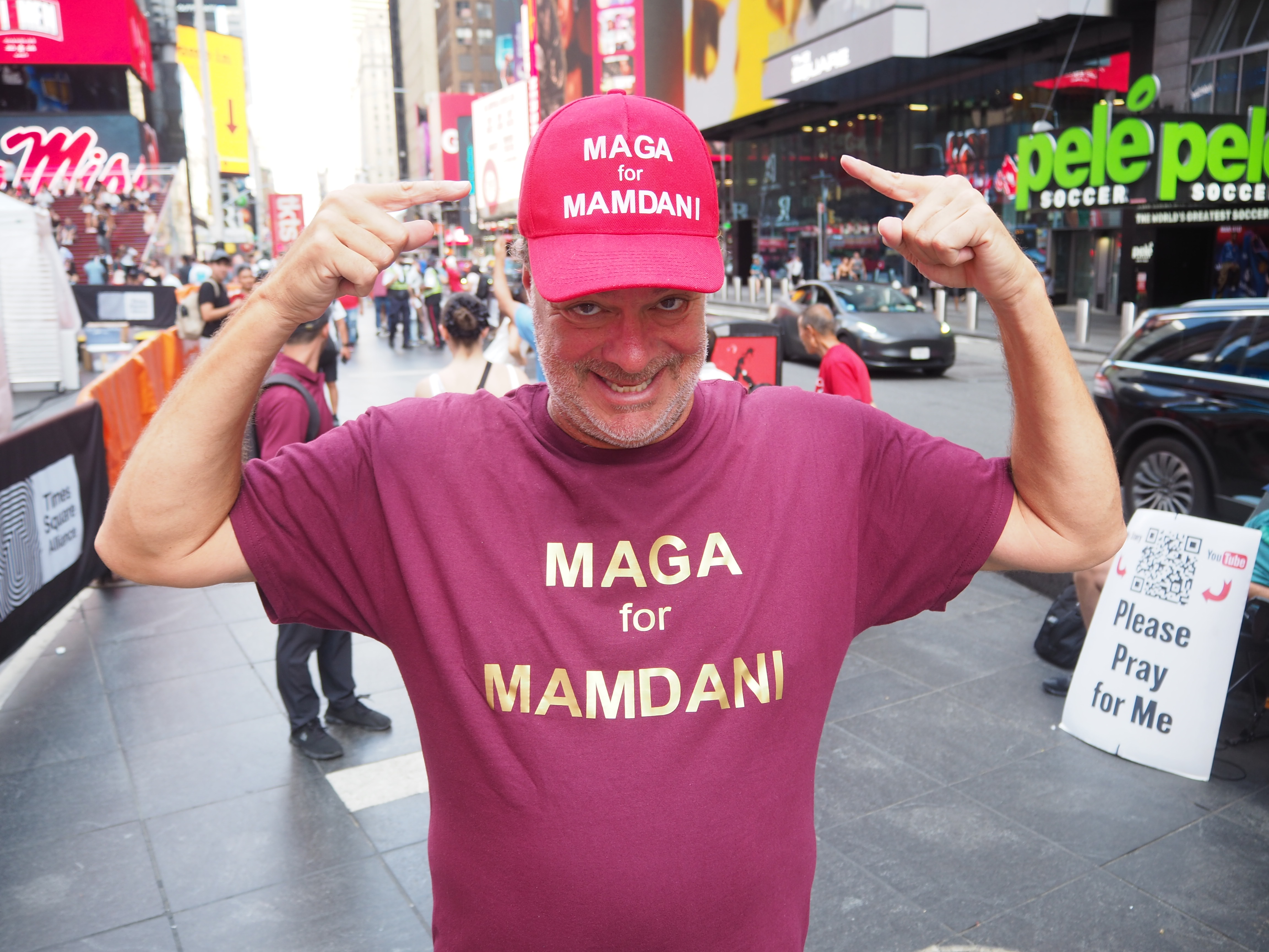 Ron Barba points to his "MAGA for Mamdani" hat