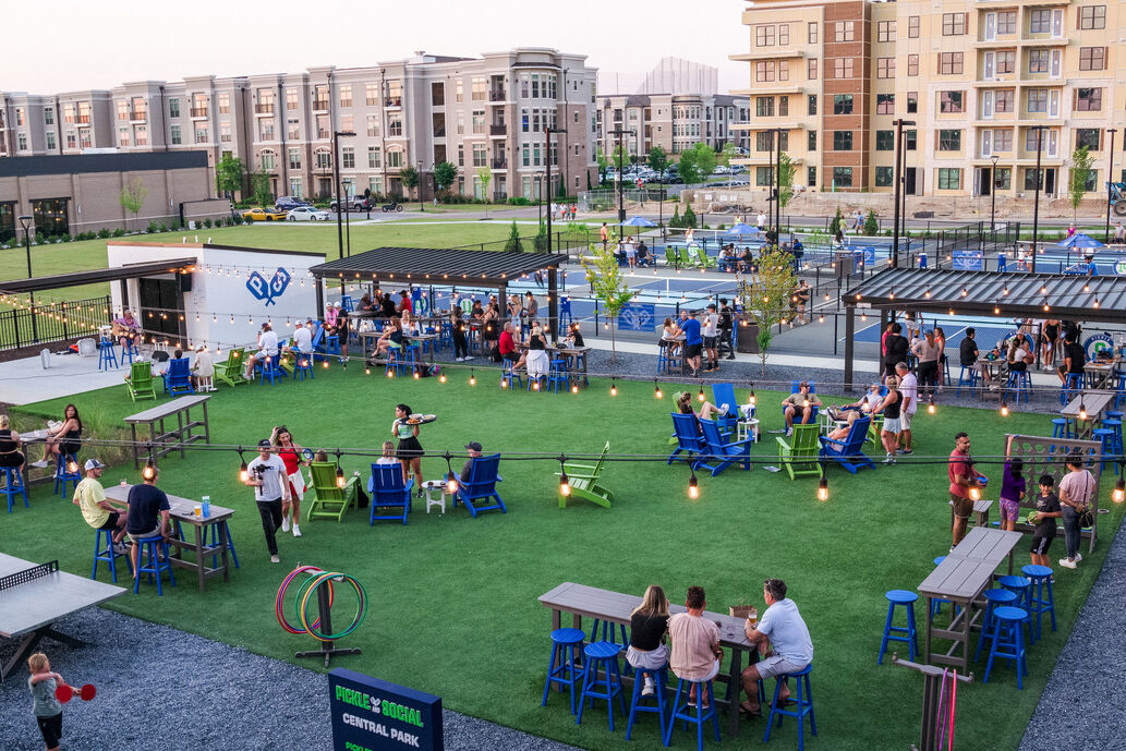 Pickle and Social opened its Gwinnett County, Georgia, location in 2023. Far beyond just pickleball, the facility also boasts a full-service restaurant, a pet-friendly outdoor lawn and Biergarten, a 27-foot music stage, an ACL cornhole yard and a concert viewing space [Courtesy of Pickle and Social]