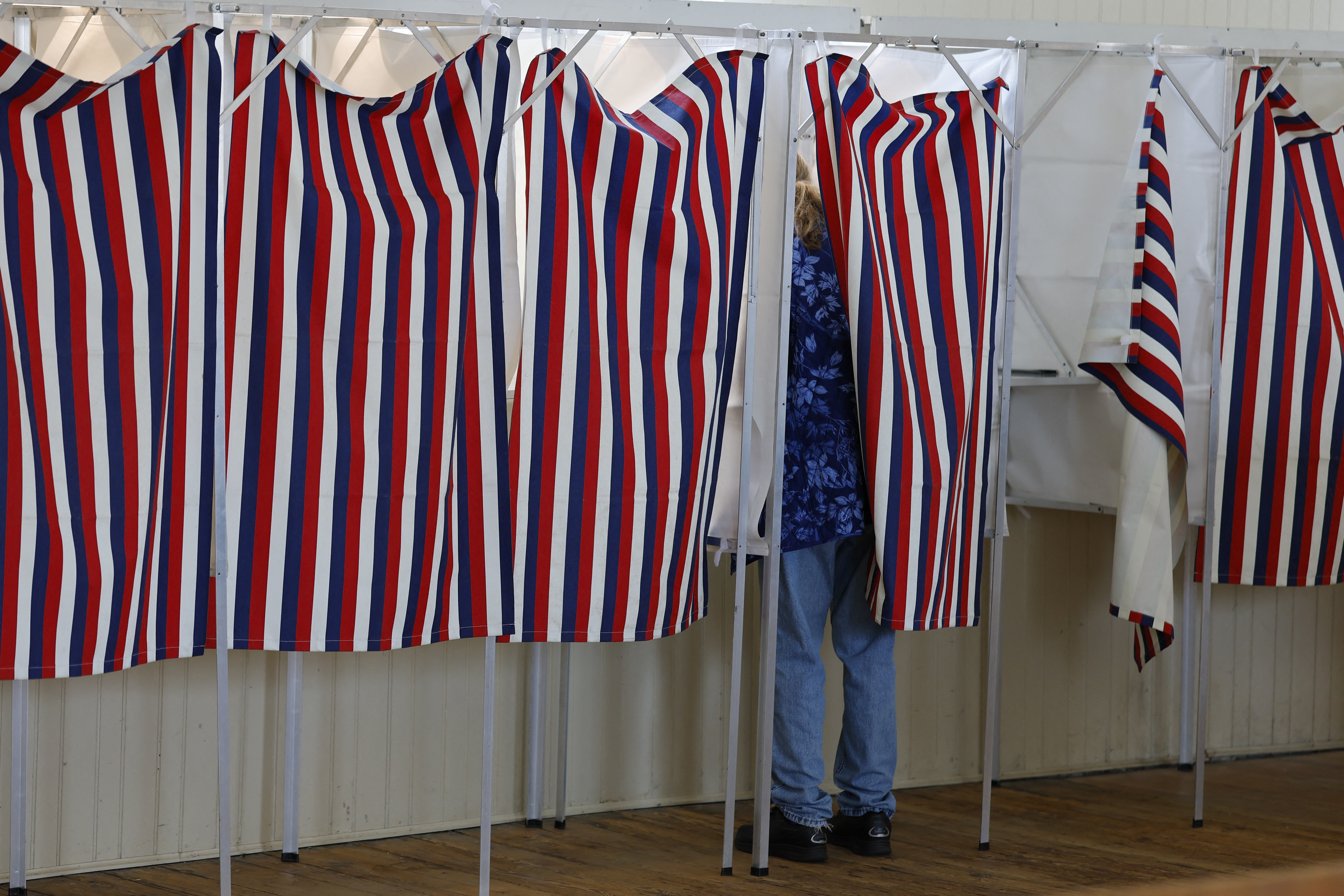 Voters cast their ballots in the primary for midterm elections at Sanbornton Town Hall, New Hampshire