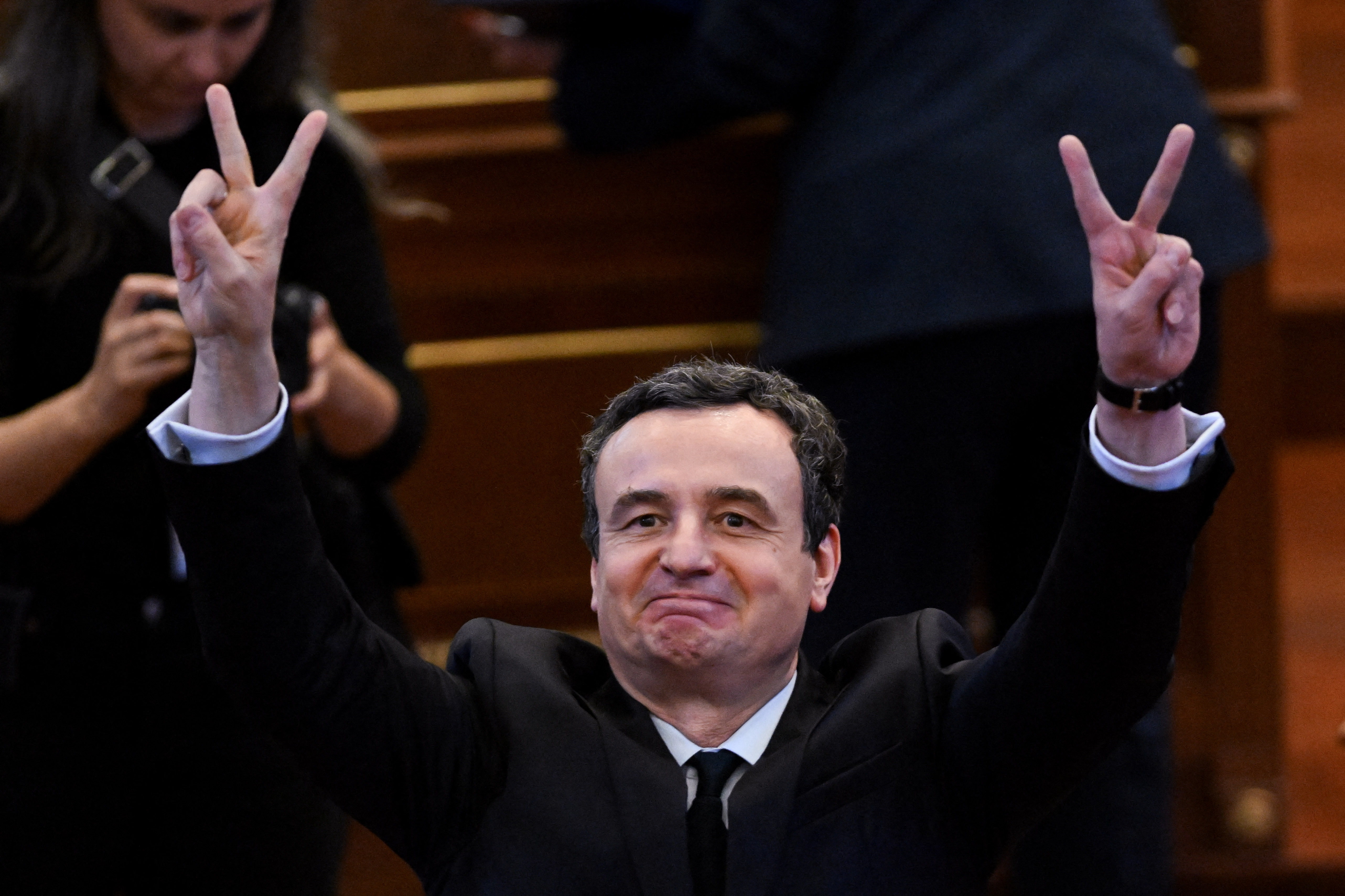 Newly elected Prime Minister of Kosovo Albin Kurti flashes a victory sign after a session in the parliament to form the new government, in Pristina on September 13, 2026.