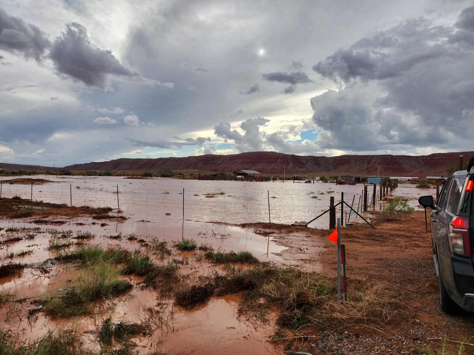 In this photo provided by the Navajo Nation Police Department, a vehicle stops close to floodwaters near Chinle, Ariz., Tuesday, Sept. 15, 2026. (Navajo Police Department via AP) ADDITION: Adds near Chinle, Arizona