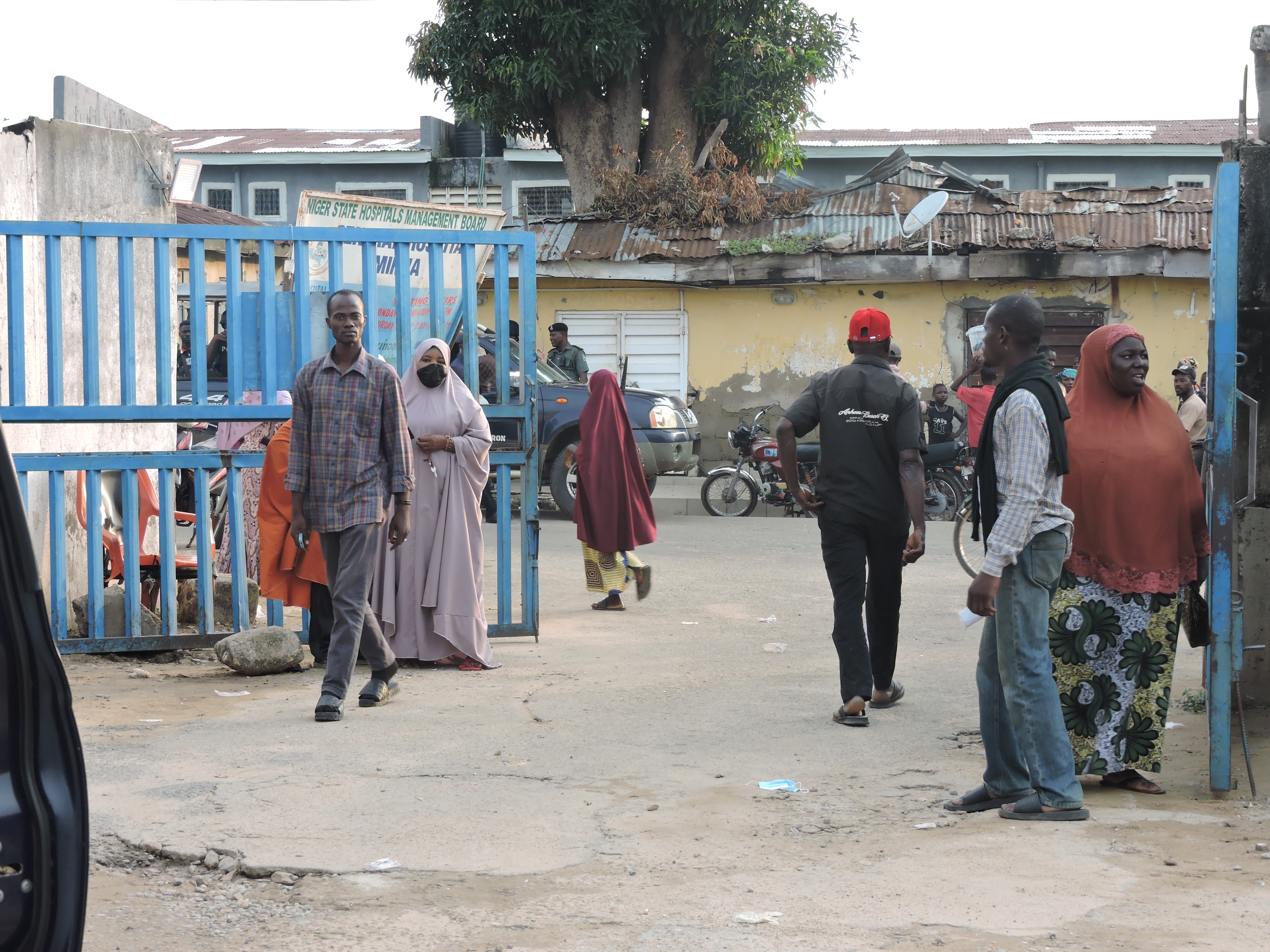 Families and relatives of miners who were arrested on suspicion of illegal mining wait outside a hospital where their bodies are stored in Minna, Nigeria, Thursday, Sept. 17, 2026. (AP Photo/Muhammed Nura)