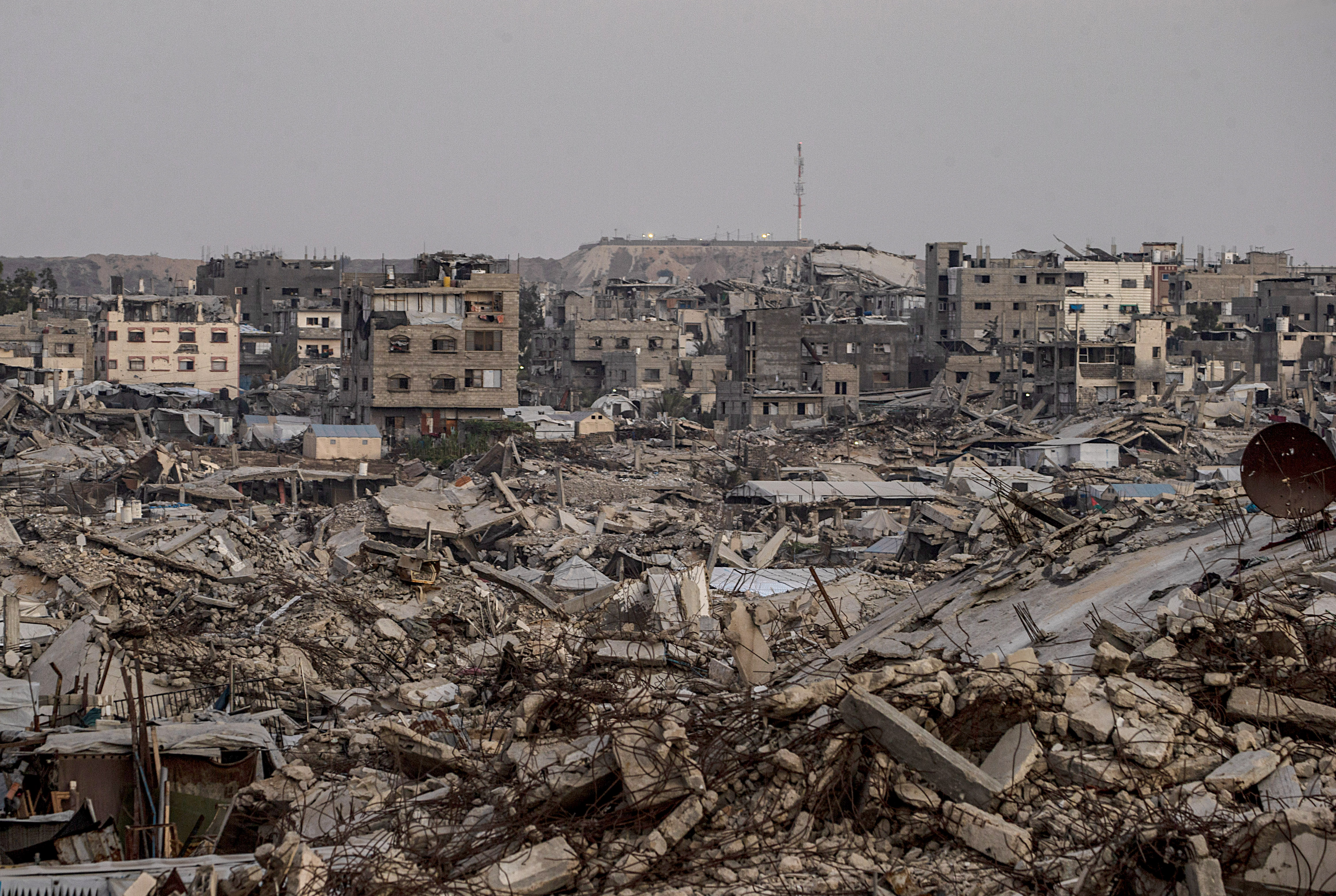 epa13230899 An Israeli military site is seen in the background behind destroyed residential buildings in the Al-Sheikh Radwan neighborhood, east of Gaza City, Gaza Strip, 10 September 2026 (issued 11 September 2026). Around 1.9 million people in Gaza, nearly 90 percent of the population, have been displaced since the Israel-Hamas conflict began in October 2023, according to the UN. EPA/MOHAMMED SABER