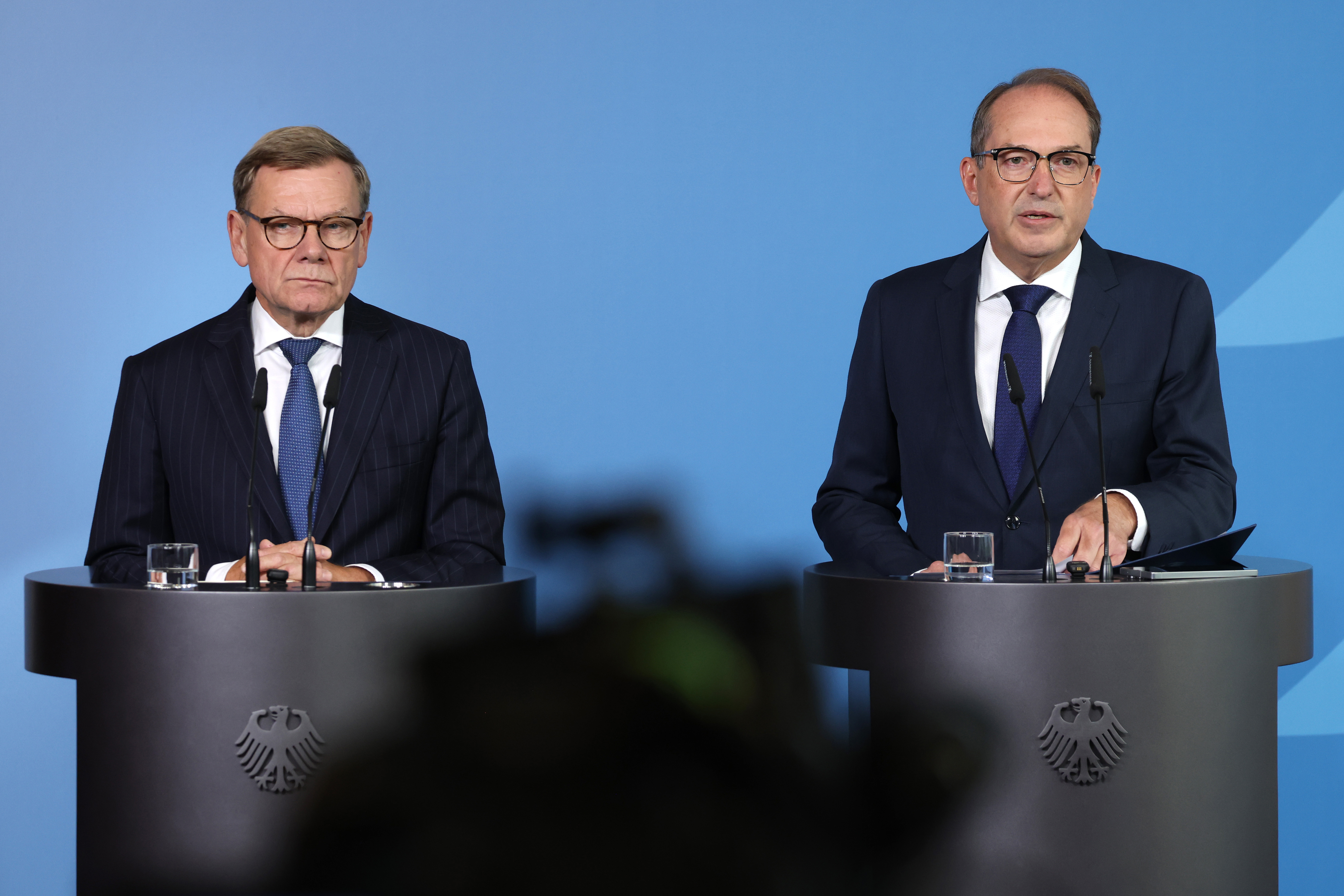 BERLIN, GERMANY - SEPTEMBER 1: German Foreign Minister Johann Wadephul (L) and Interior Minister Alexander Dobrindt speak to the media to announce Germany's response to the failed drone attack at Leipzig airport on September 1, 2026 in Berlin, Germany. The German government blames Russia for the August 5 incident in which at least two drones, including one carrying explosives, were involved in a failed attack against Ukrainian cargo planes stationed at Leipzig. (Photo by Sean Gallup/Getty Images)