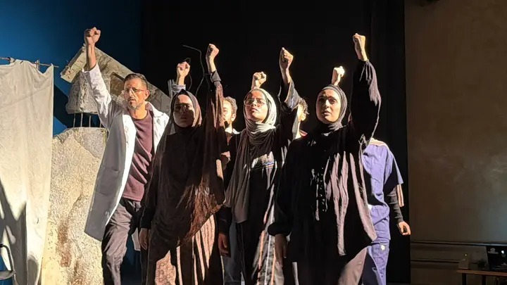 Actors perform a scene from 50 Minutes in Gaza, a play shaped by their experiences of war, siege and displacement