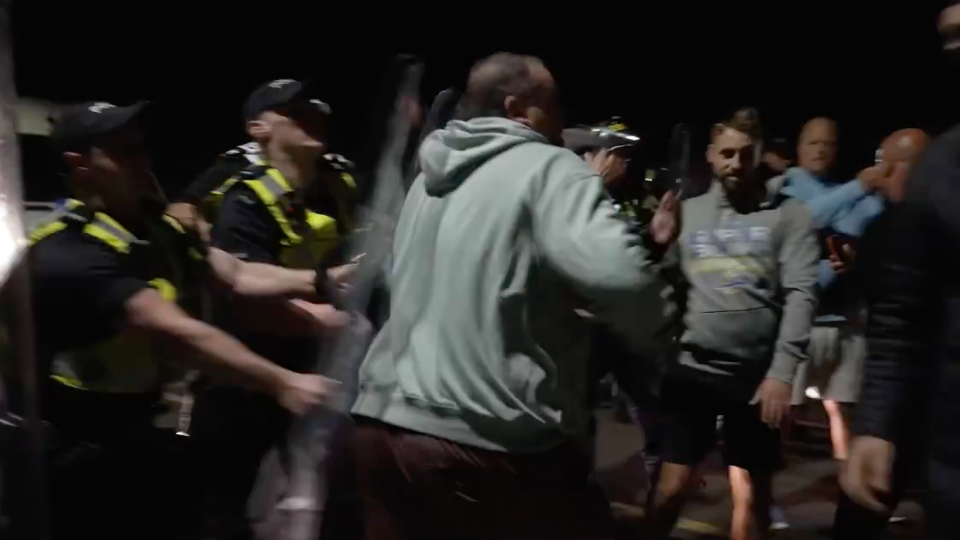 Anti-immigration protesters clash with police in UK after boat arrival