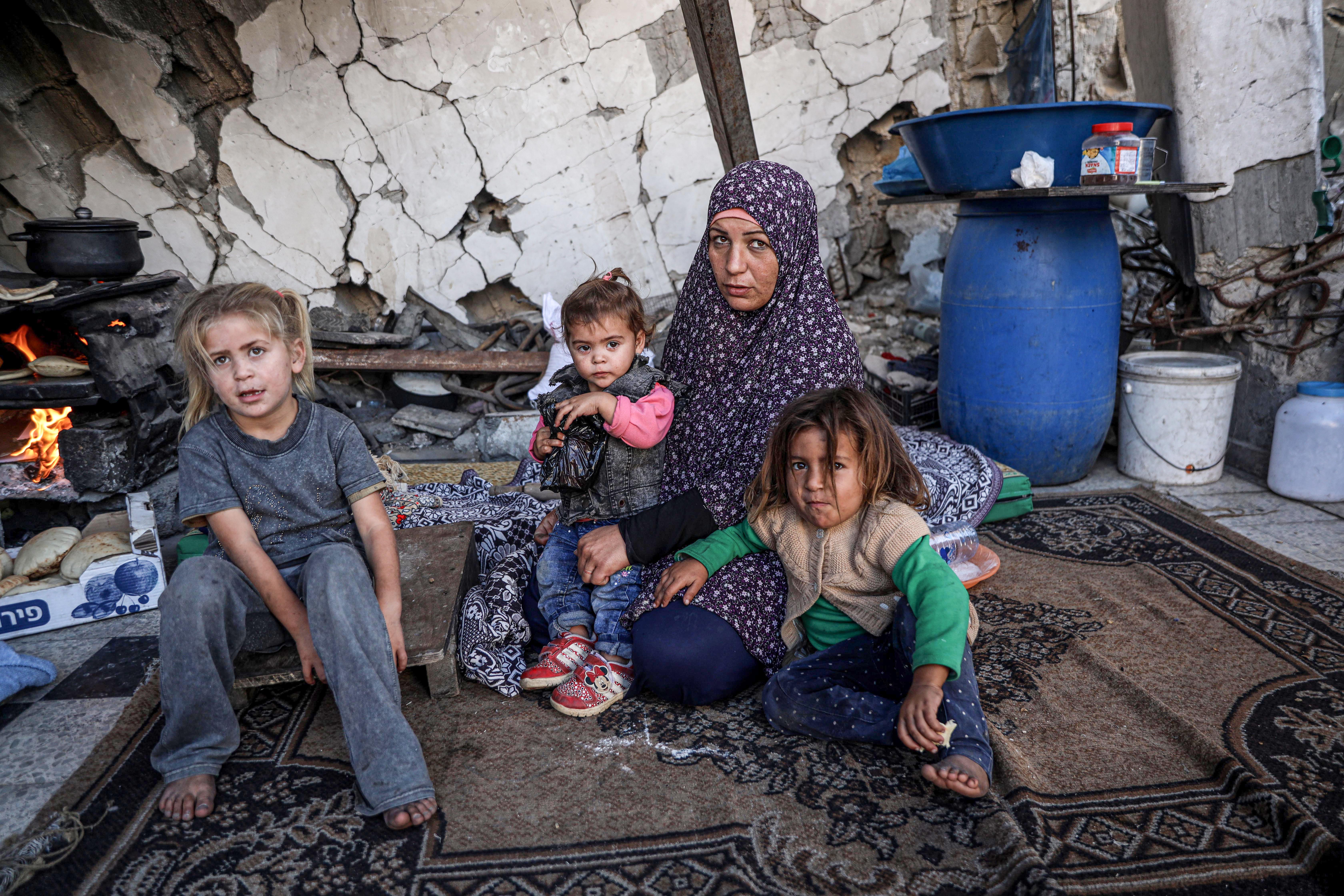 Huda Abu Leila, 30, says she is struggling to provide nutritious food for her five daughters amid rising prices and shortages in Gaza. [Abdelhakim Abu Riash/Al Jazeera]