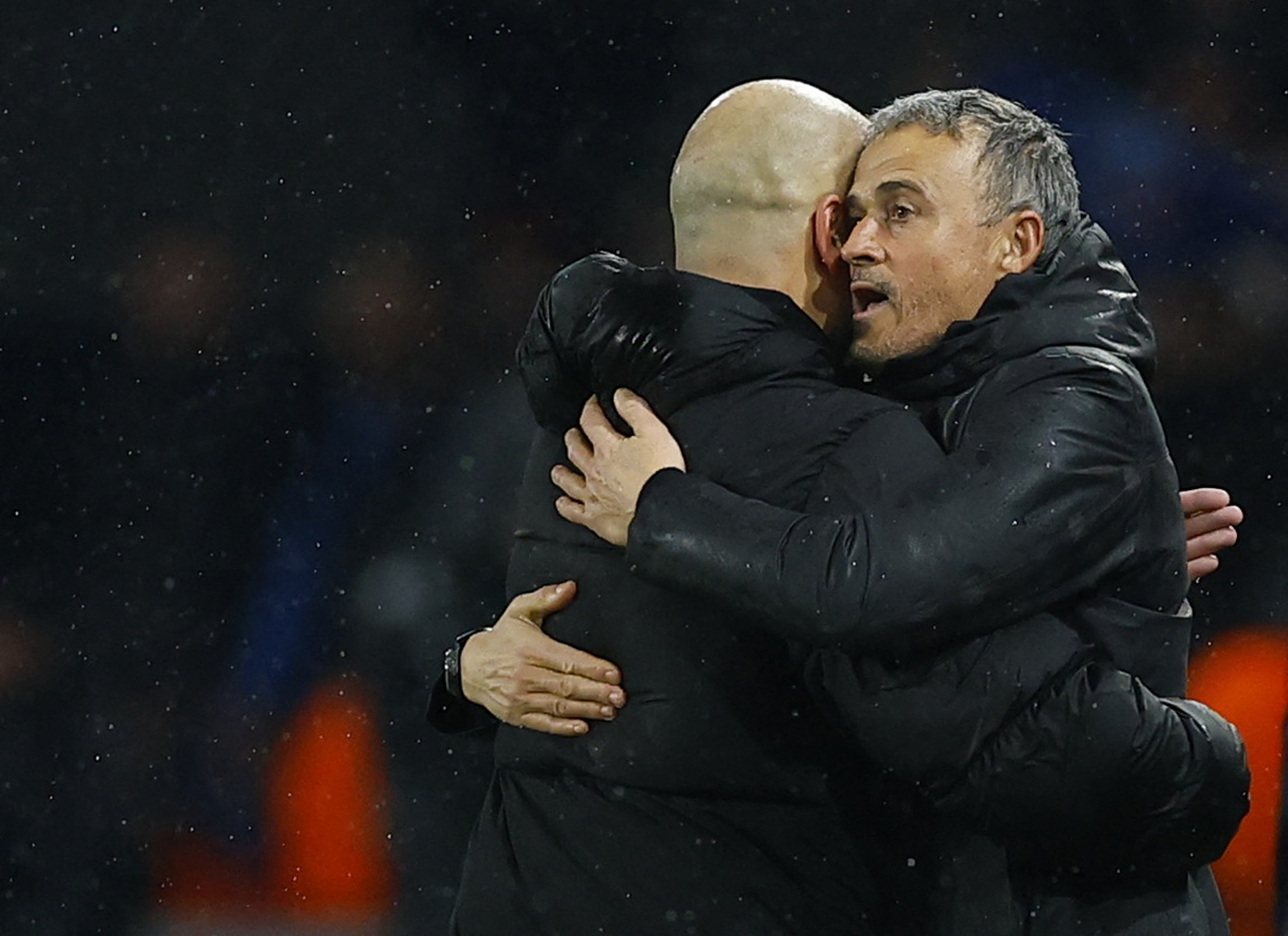 Soccer Football - Champions League - Paris St Germain v Manchester City - Parc des Princes, Paris, France - January 22, 2025 Paris St Germain coach Luis Enrique and Manchester City manager Pep Guardiola embrace after the match REUTERS/Stephanie Lecocq