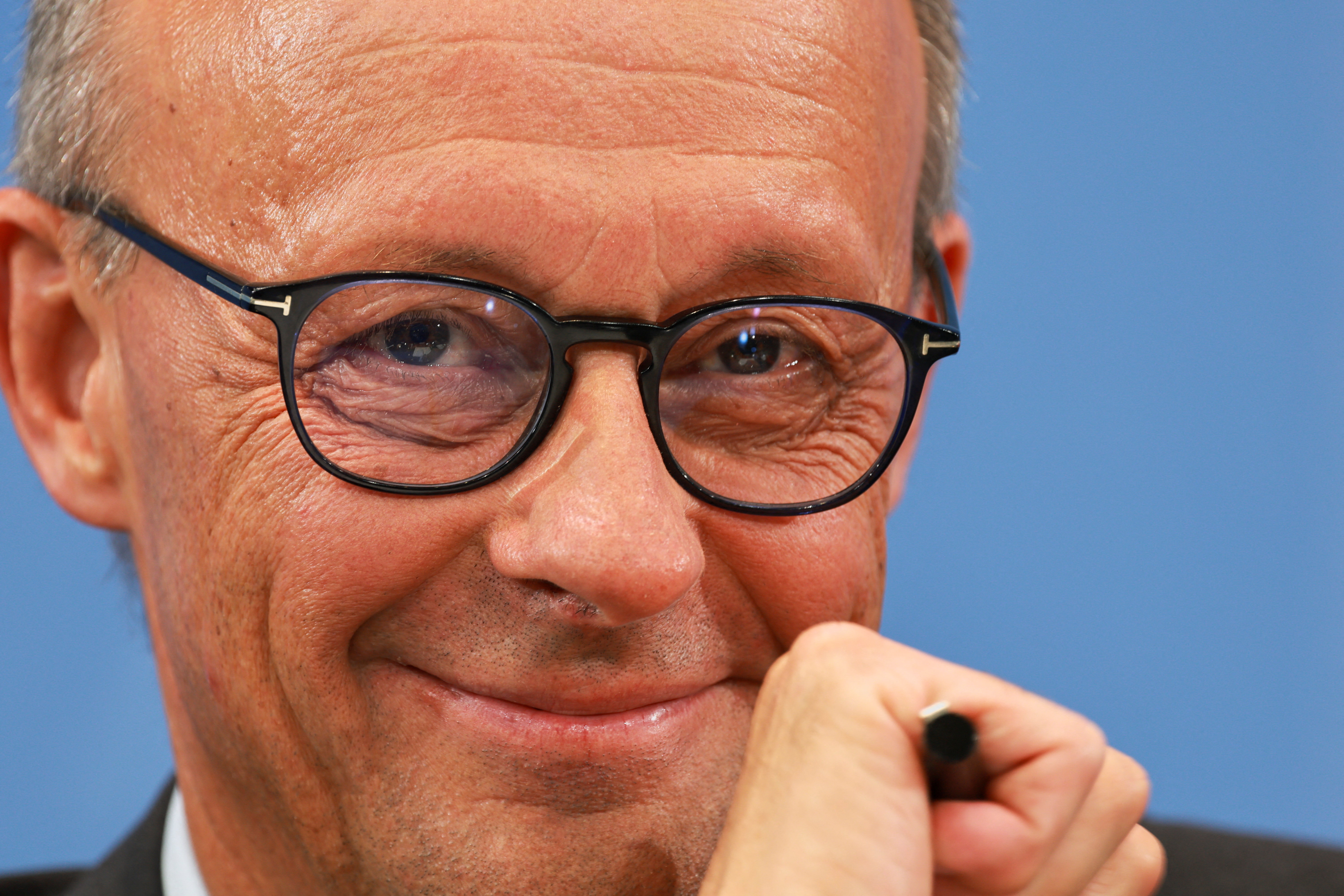 German Chancellor and leader of the Christian Democratic Union (CDU) Friedrich Merz smiles as he attends a statement after coalition committee talks in Berlin, Germany. September 3, 2025. REUTERS/Fabrizio Bensch TPX IMAGES OF THE DAY