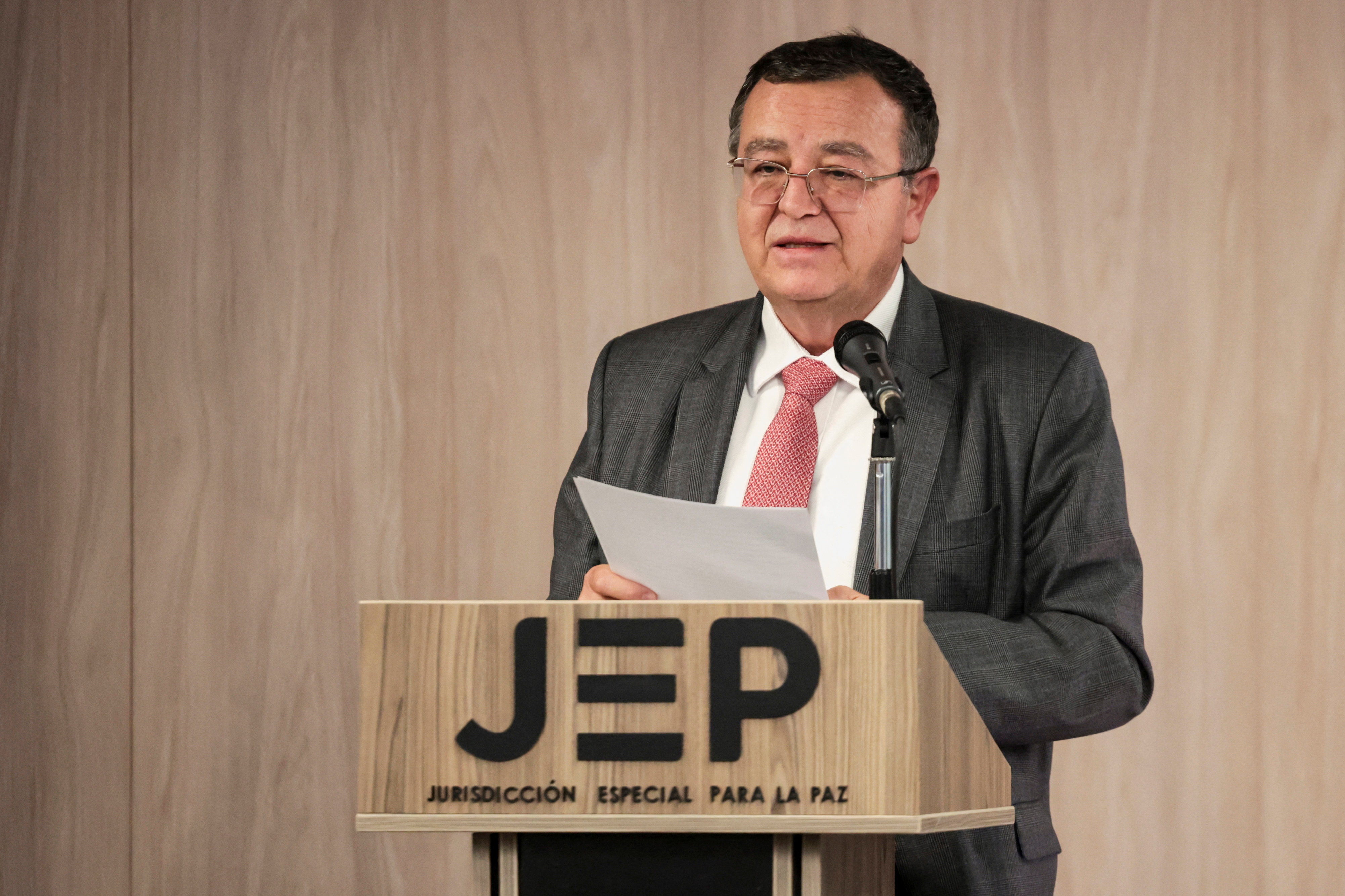 Colombian Magistrate Alejadro Ramelli of the Special Jurisdiction for Peace (JEP) speaks during the reading of the sentences against 12 former soldiers for their role in extrajudicial executions, in Bogota, Colombia September 18, 2025. REUTERS/Luisa Gonzalez