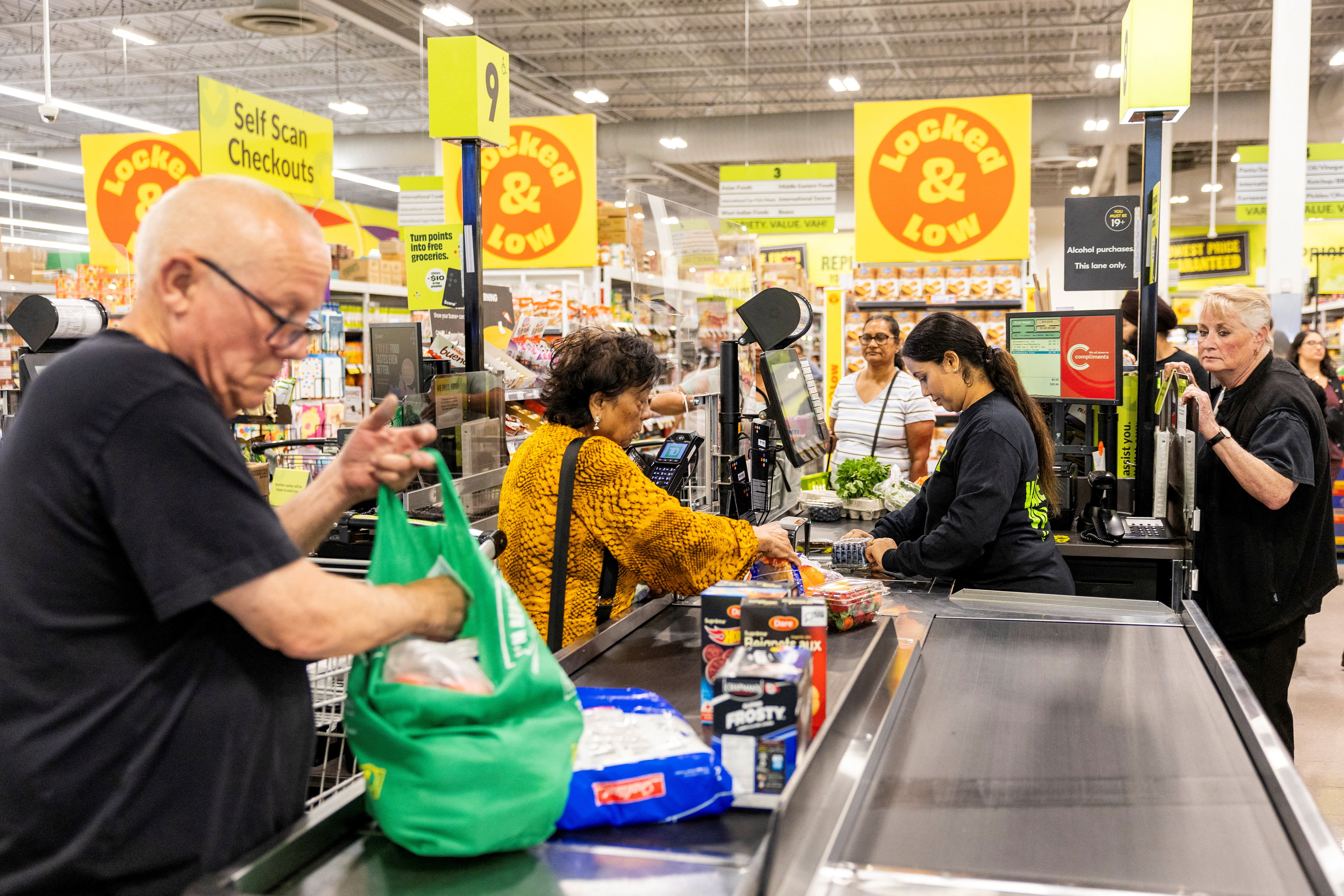 Customers check out with their purchases at Chalo FreshCo grocery store in Brampton, Ontario, Canada