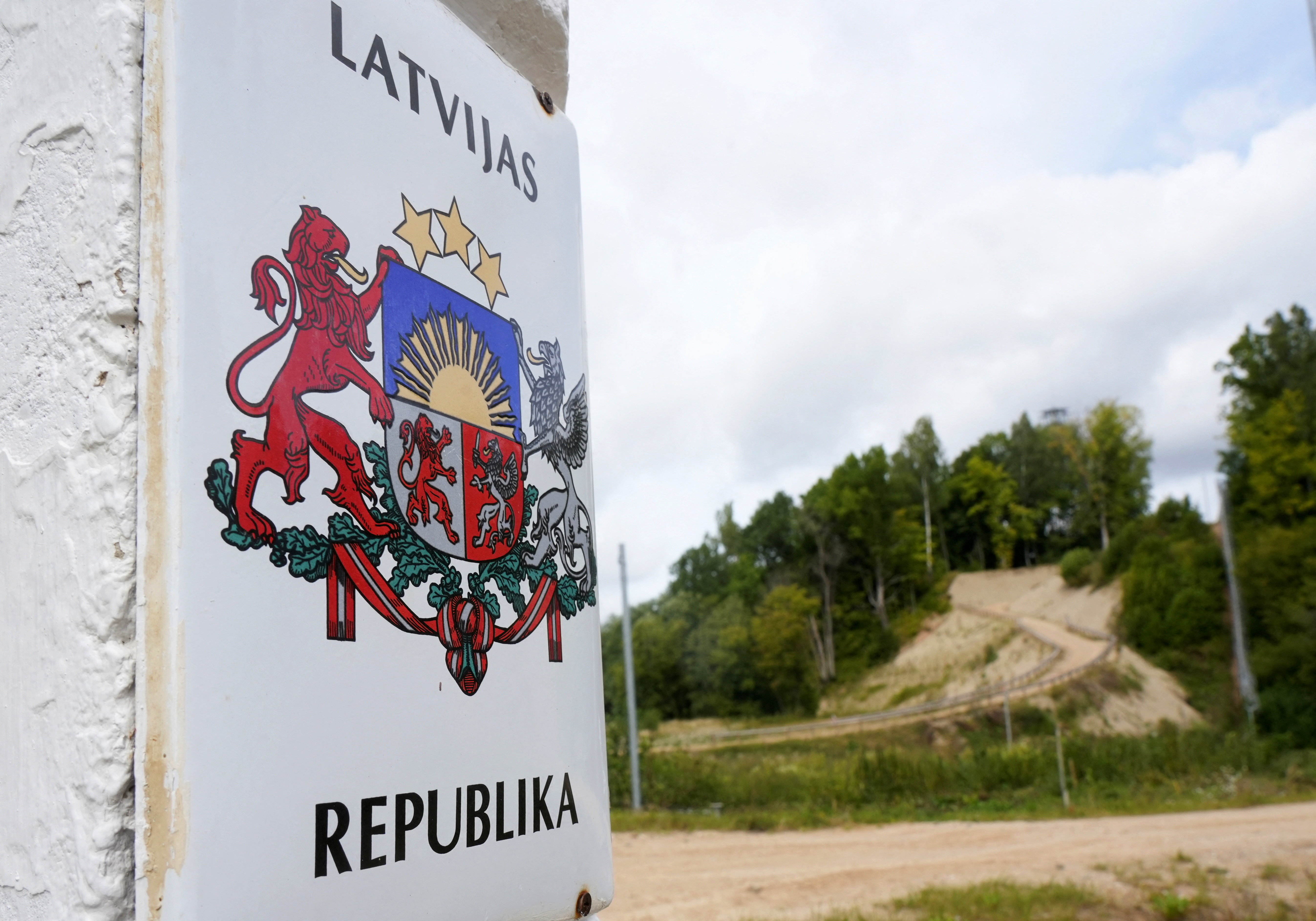 A 'Republic of Latvia' sign at the border with Belarus near Piedruja, Latvia, August 17, 2026. REUTERS/Ints Kalnins