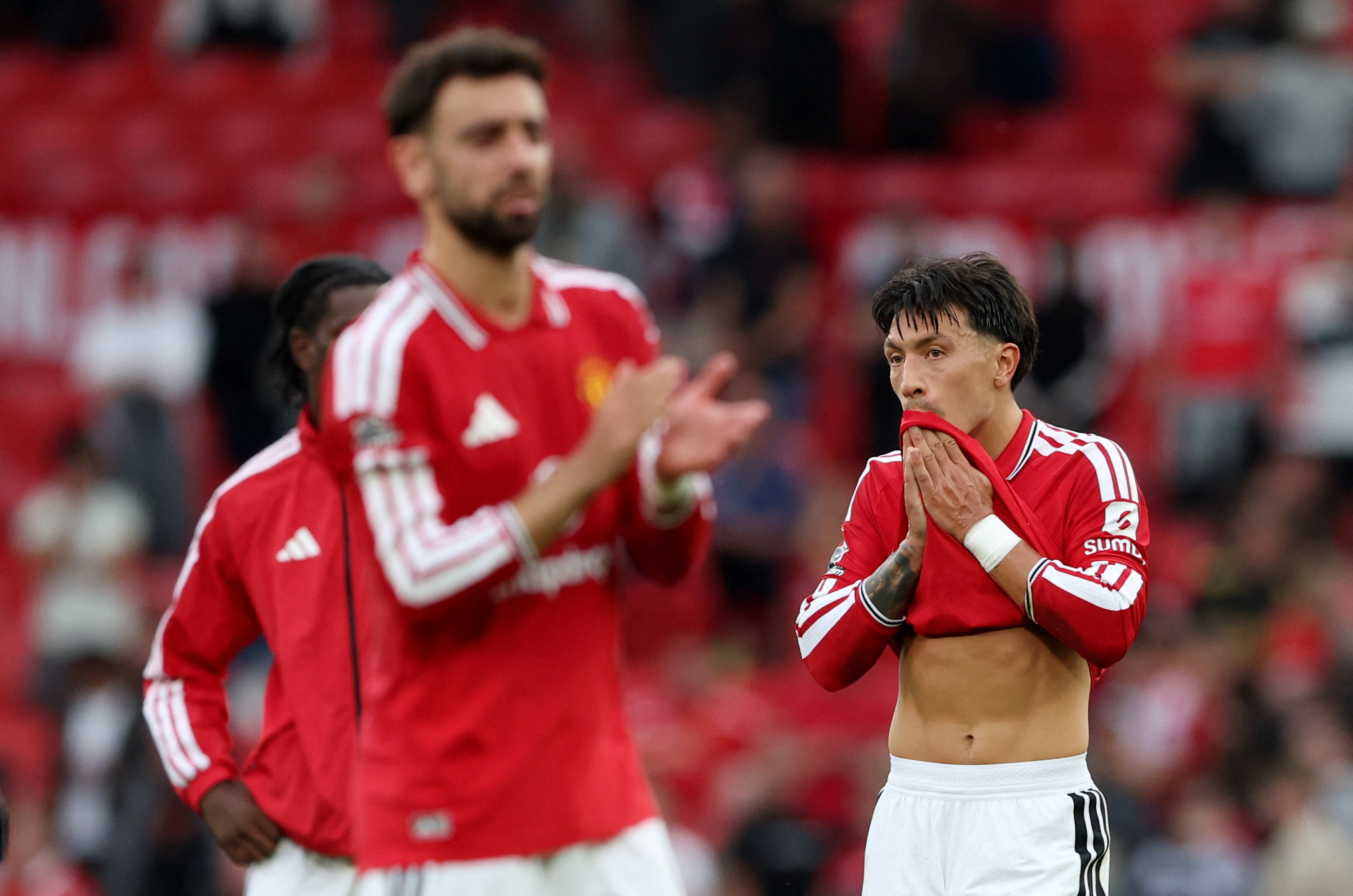 Manchester United's Bruno Fernandes and Lisandro Martinez looks dejected after a Premier League match