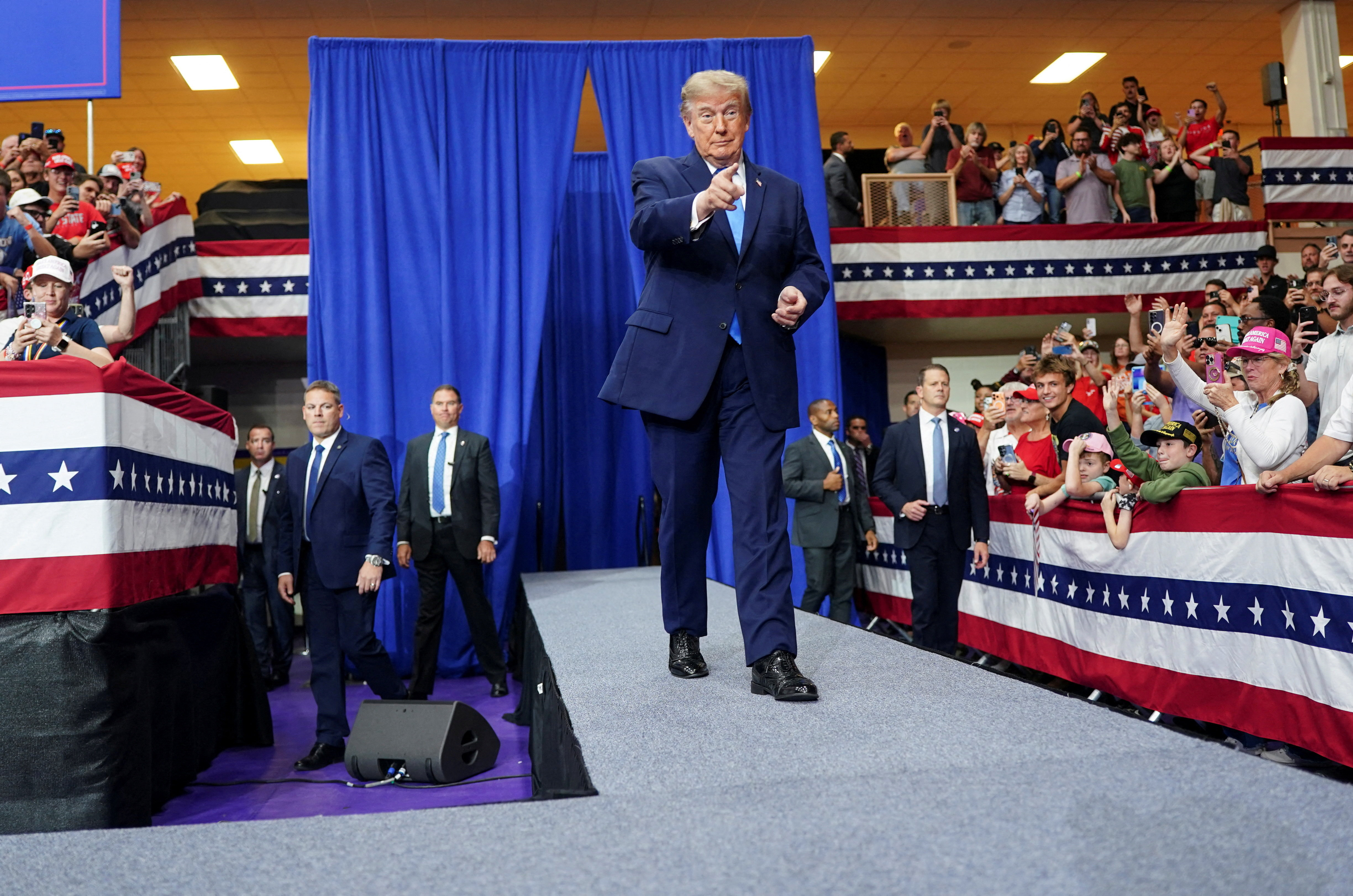 US President Donald Trump gestures as he walks during a rally at Butler High School in Vandalia, Ohio, US, October 3, 2026.