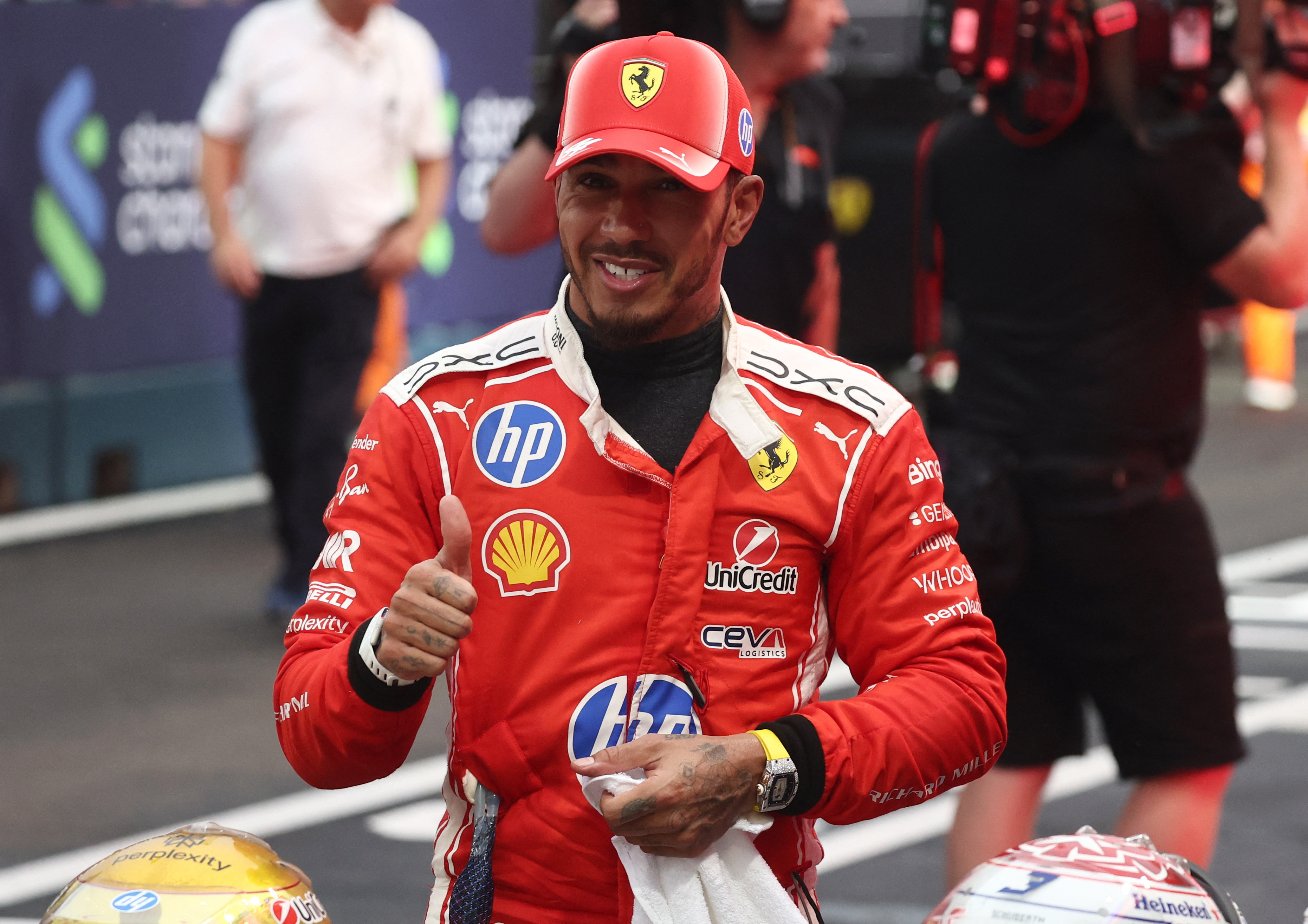 Formula One F1 - Singapore Grand Prix - Marina Bay Street Circuit, Singapore - October 10, 2026 Ferrari's Lewis Hamilton celebrates after finishing second in the sprint race REUTERS/Jakub Porzycki