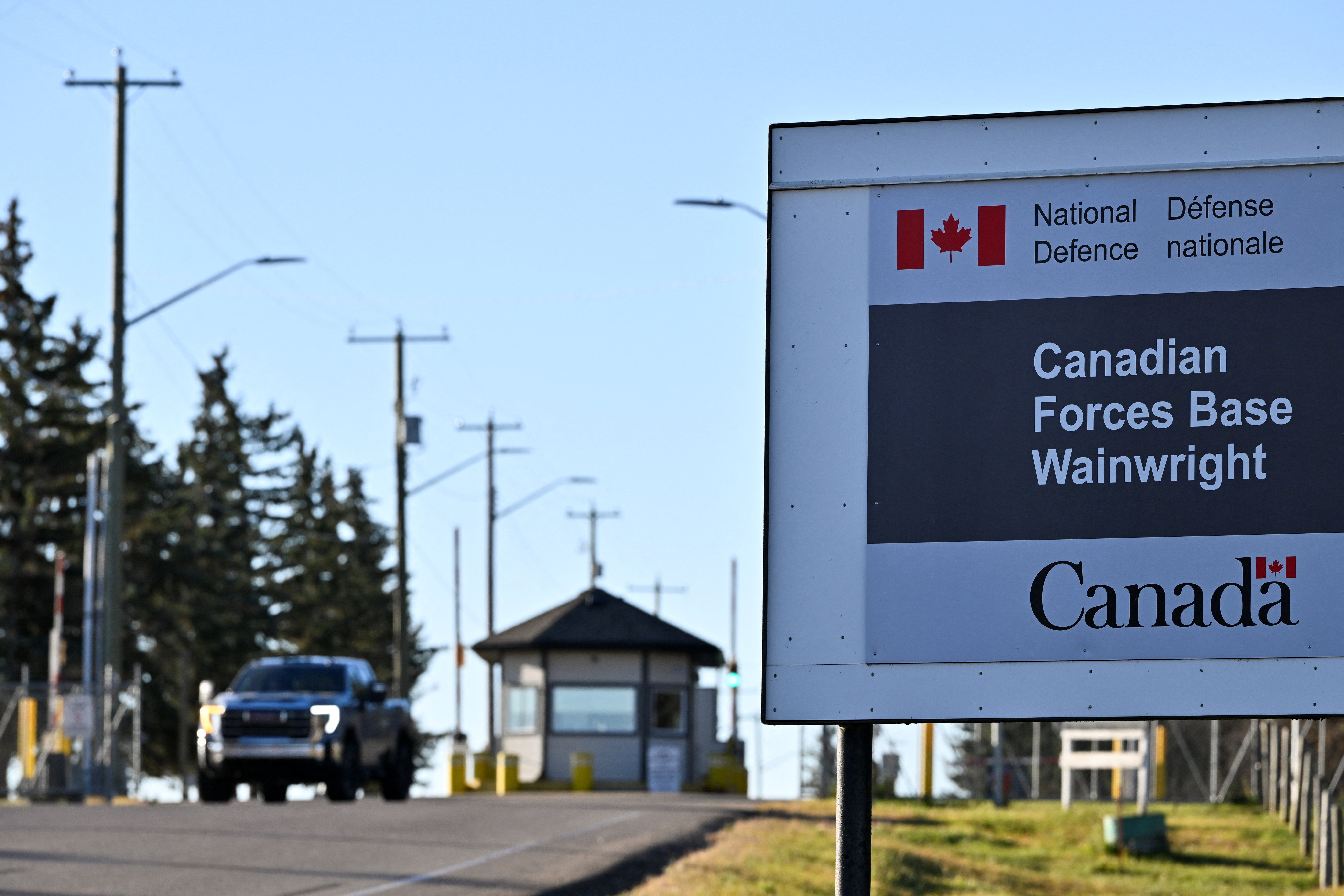 A sign for Canadian Forces Base (CFB) Wainwright, the day after a serious incident that resulted in a fire caused deaths and injuries, in Wainwright, Alberta, Canada, October 18, 2026. REUTERS/Jennifer Gauthier