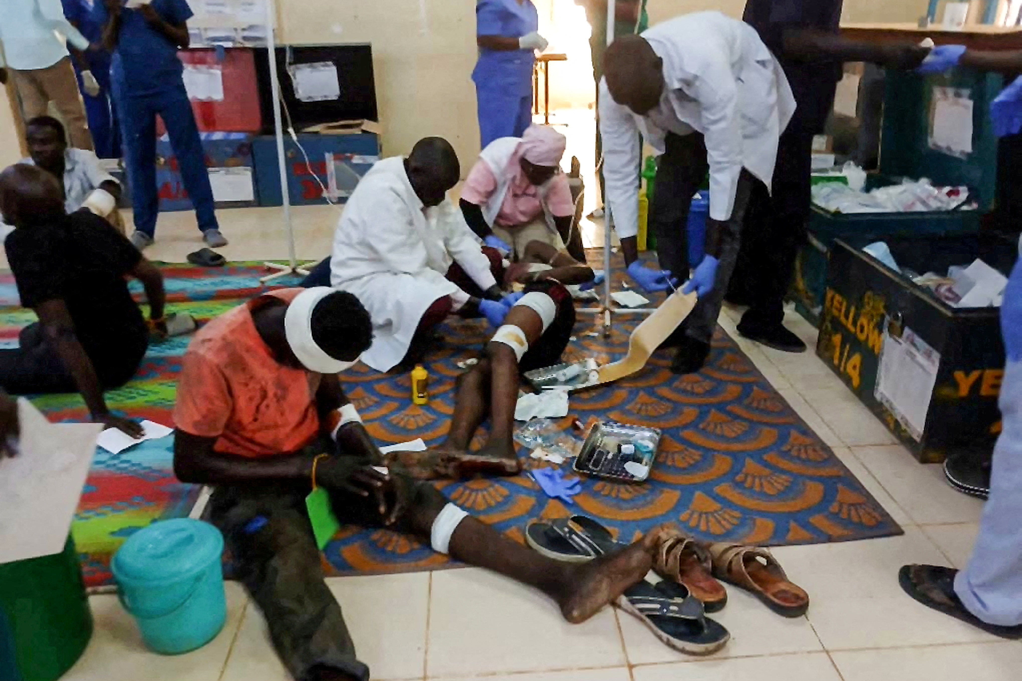 Medical workers treat injured people at a hospital after a drone strike on a market in the disputed Abyei region along the border between South Sudan and Sudan