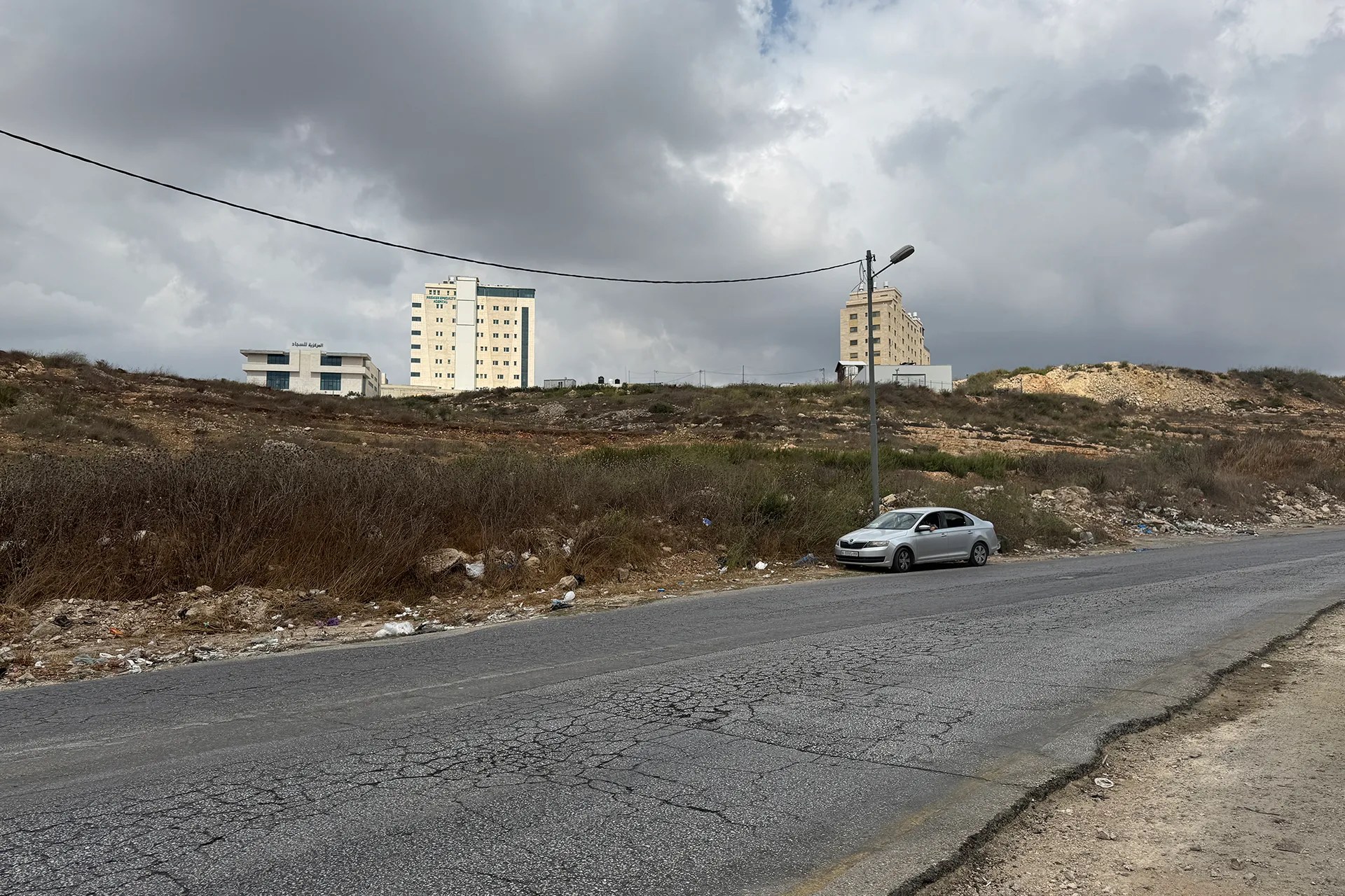 The land of Palestinian citizen Raed Abu Al-Adas is directly adjacent to Route 463 [Al Jazeera]