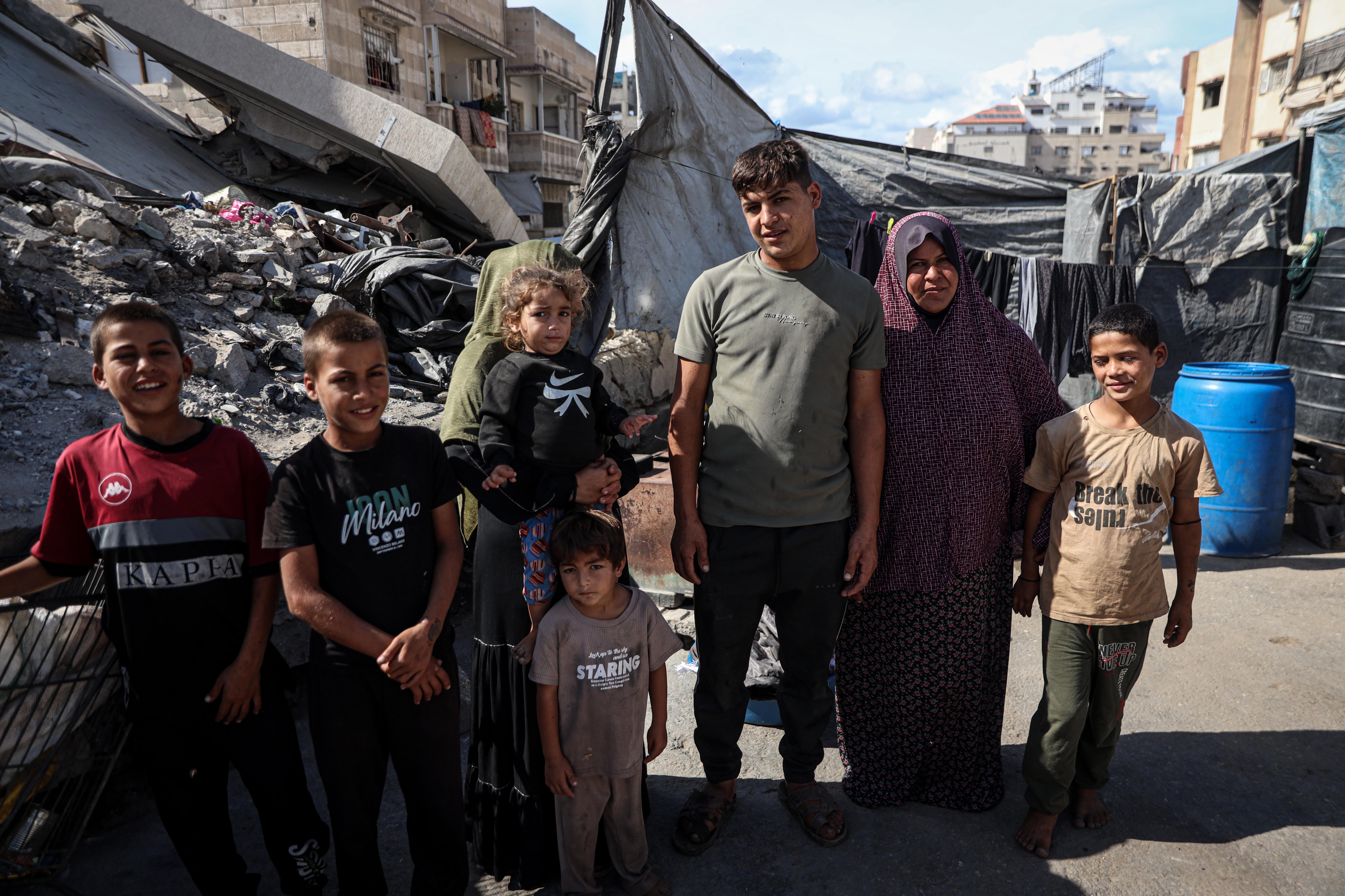 Raeda Soboh says her family has relied on community kitchens for months, while her children have gone without milk, meat, eggs and cheese. [Abdelhakim Abu Riash/Al Jazeera]