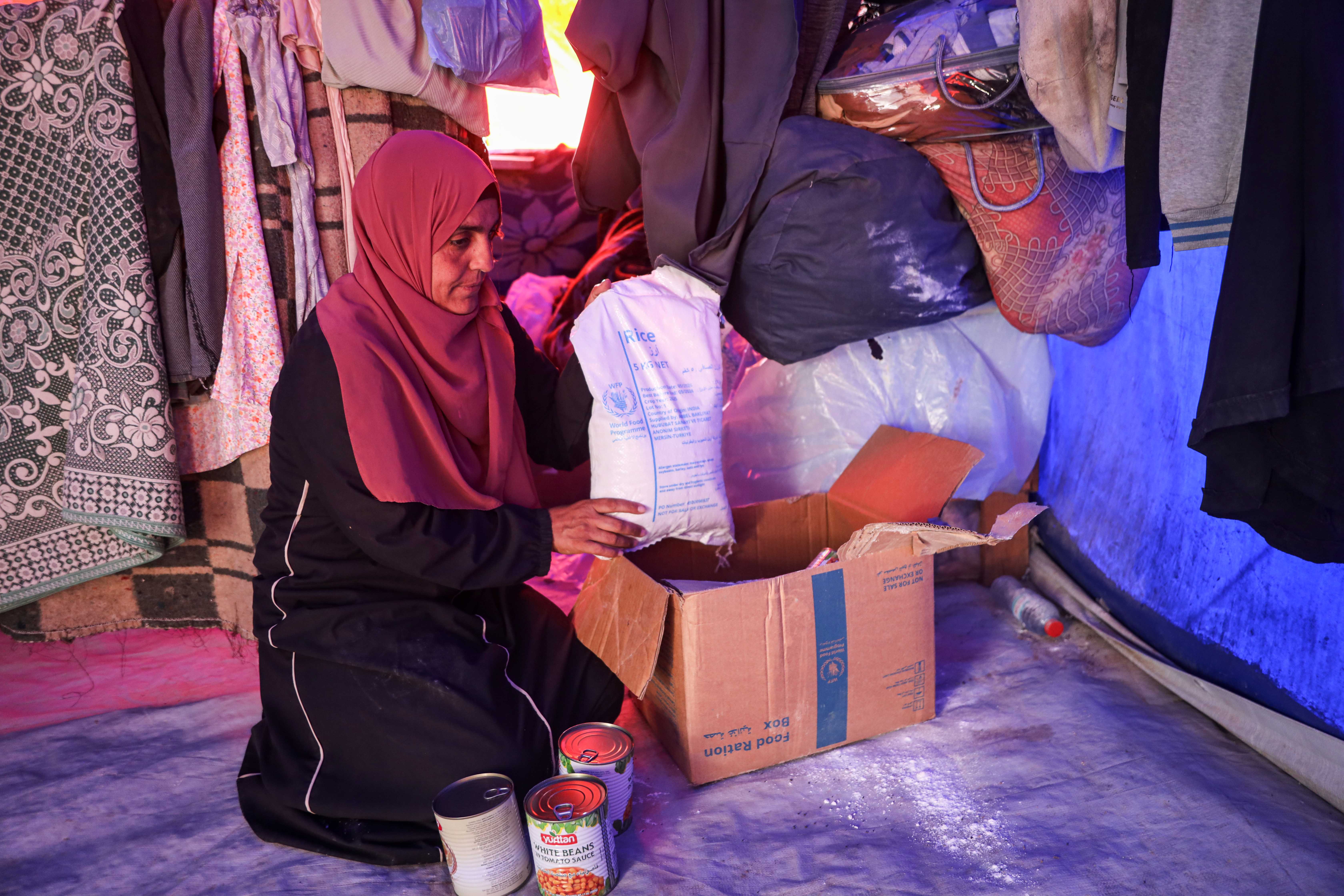 Manal Abu Rabie, a displaced mother of six from northern Gaza, fears worsening hunger as the World Food Programme cuts food assistance