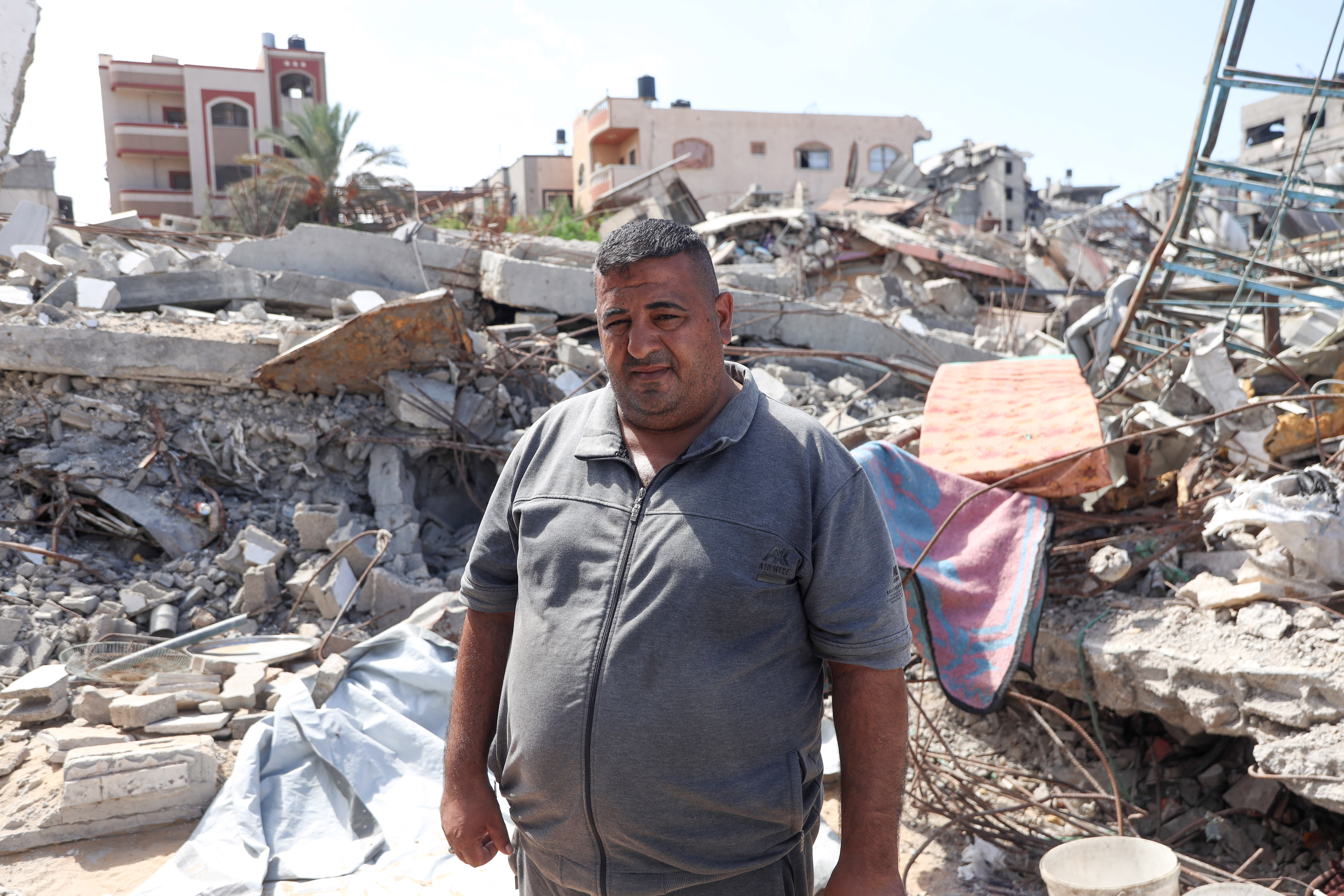 Mahmoud stands beside his family home, destroyed in an Israeli strike that killed 39 relatives.