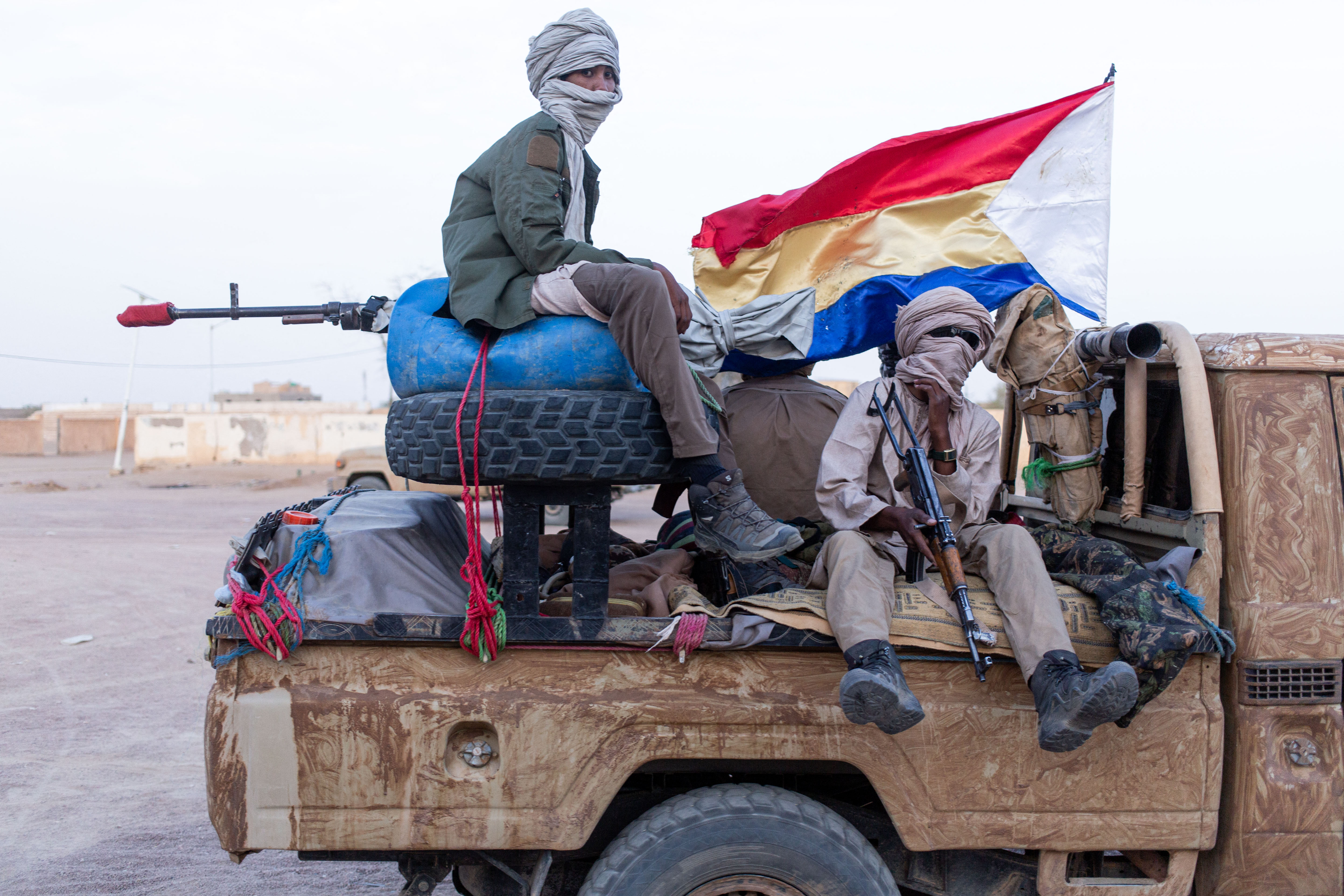 Fighters from the separatist Azawad Liberation Front patrol the streets of Kidal, Mali