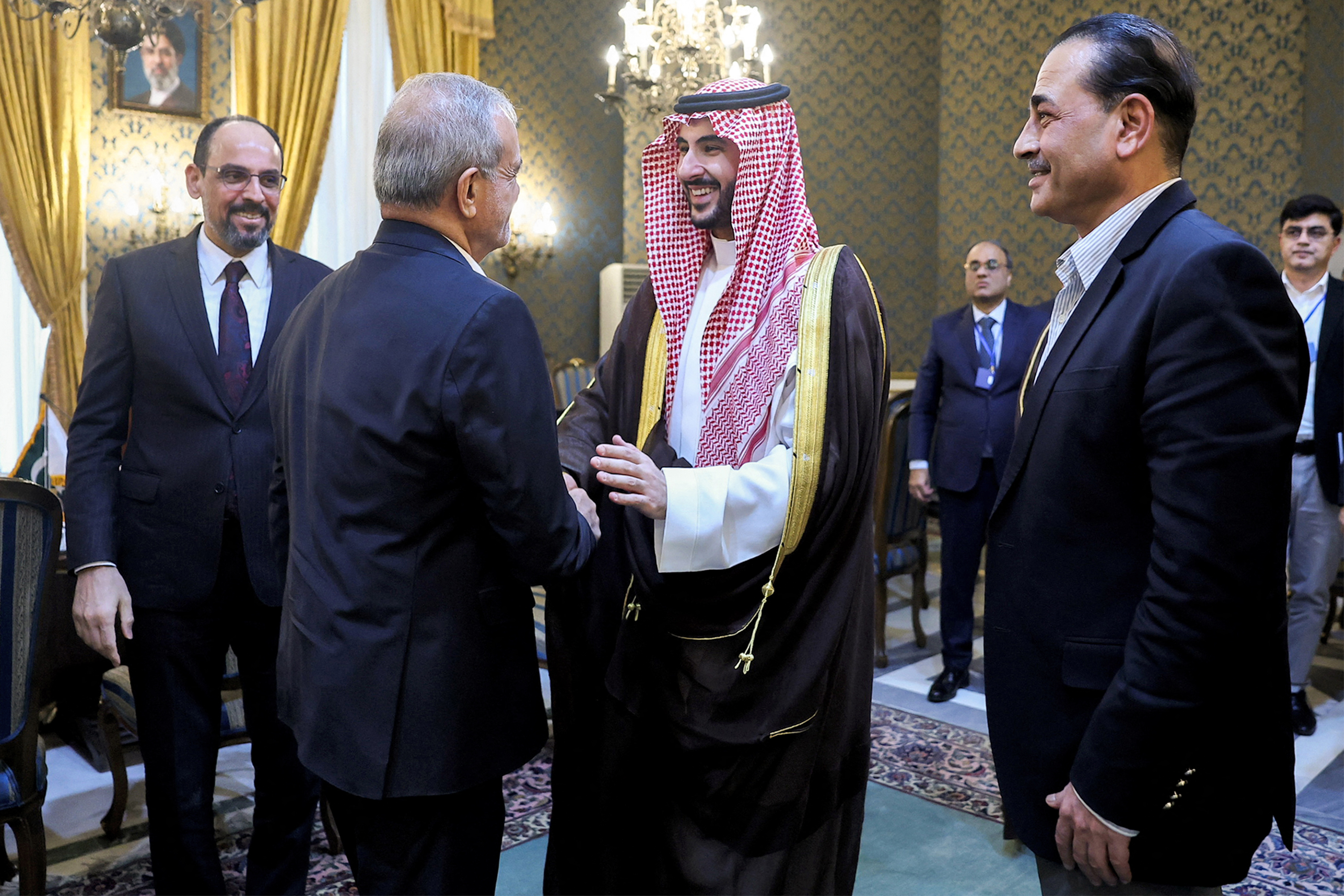 This handout picture provided by the Iranian presidency shows Iran's President Masoud Pezeshkian (C-L) shaking hands with Saudi Arabia's Defence Minister Prince Khalid bin Salman Al-Saud after a meeting with the Pakistani army chief and the Turkish intelligence chief in Tehran on October 26, 2026. Iran began talks on October 26 with the three countries of the Mecca security pact, Pakistan, Saudi Arabia and Turkey, to discuss regional issues as the months-long Middle East war remains locked in a stalemate, state television reported. (Photo by Iranian Presidency / AFP) / === RESTRICTED TO EDITORIAL USE - MANDATORY CREDIT "AFP PHOTO / HO / IRANIAN PRESIDENCY" - NO MARKETING NO ADVERTISING CAMPAIGNS - DISTRIBUTED AS A SERVICE TO CLIENTS ===