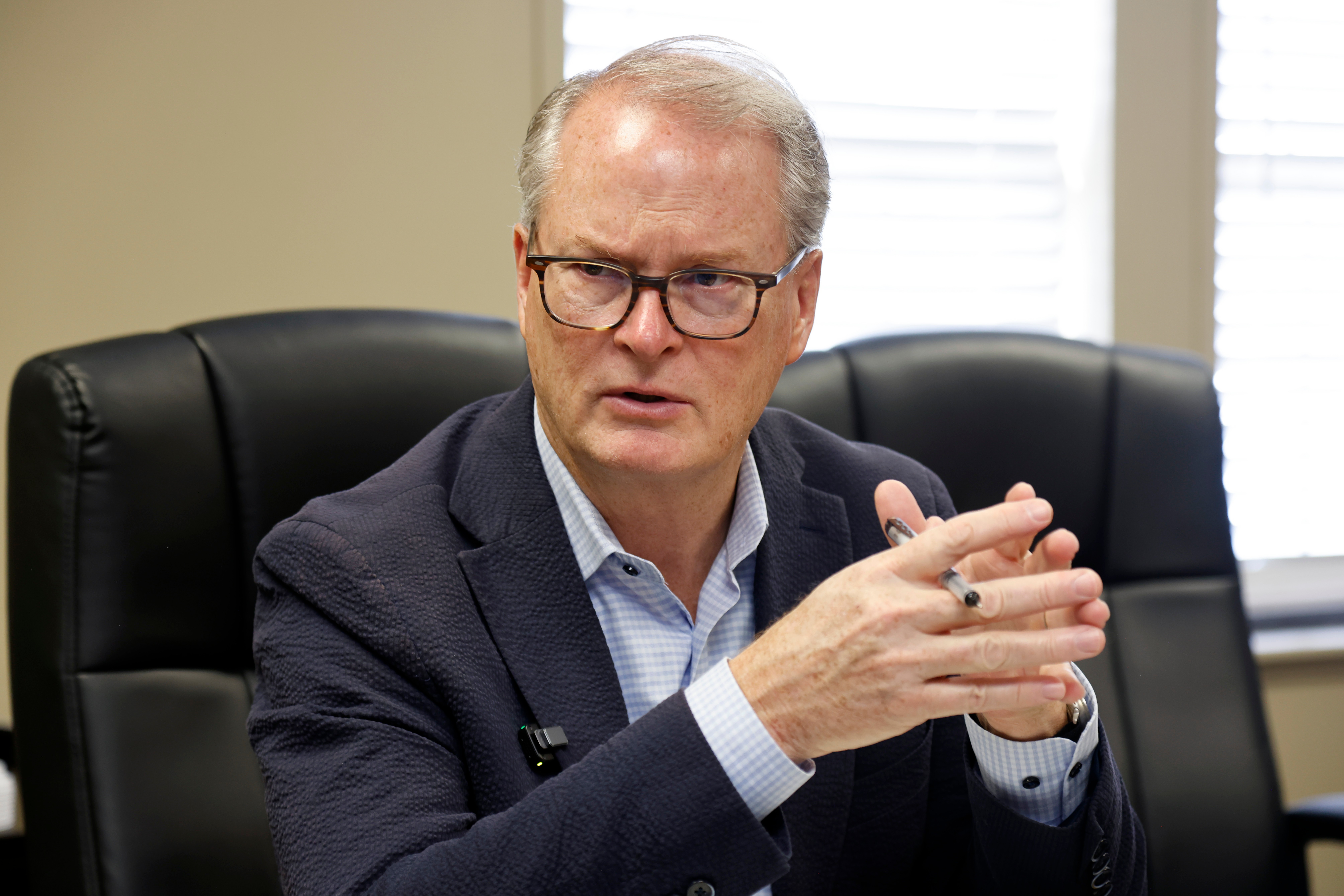 Democratic U.S. senatorial candidate Adam Hamilton of Kansas, talks about funding issues facing Medicare and Medicaid during a meeting with administrators at the Health Partnership Clinic for low-income families on Wednesday, Aug. 12, 2026, in Olathe. Kan. (AP Photo/Colin E. Braley)