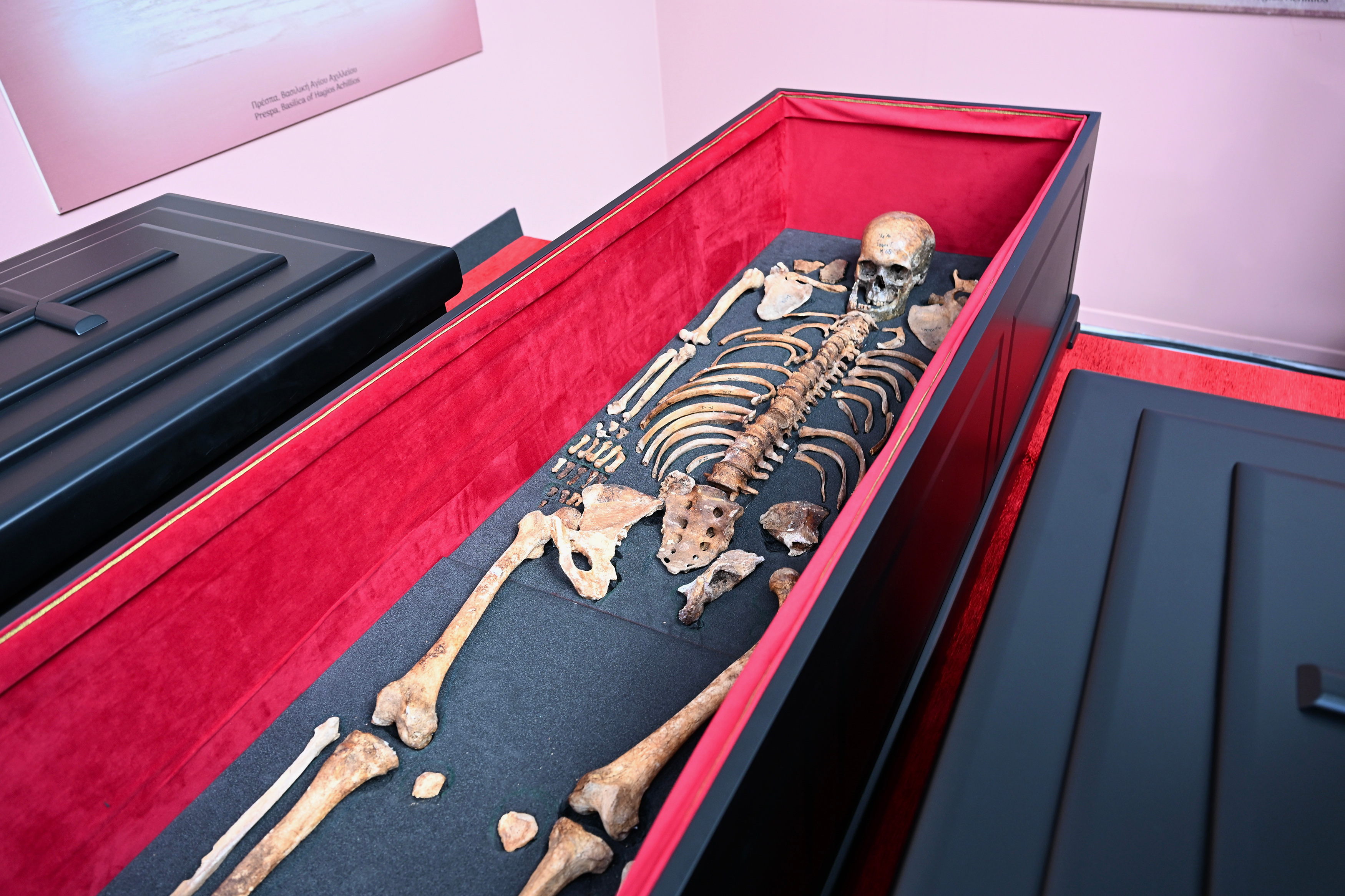 The remains of medieval ruler Czar Samuel are seen inside a coffin during a handover ceremony, in Thessaloniki, northern Greece, Saturday, Oct. 3, 2026. (AP Photo/Giannis Papanikos)