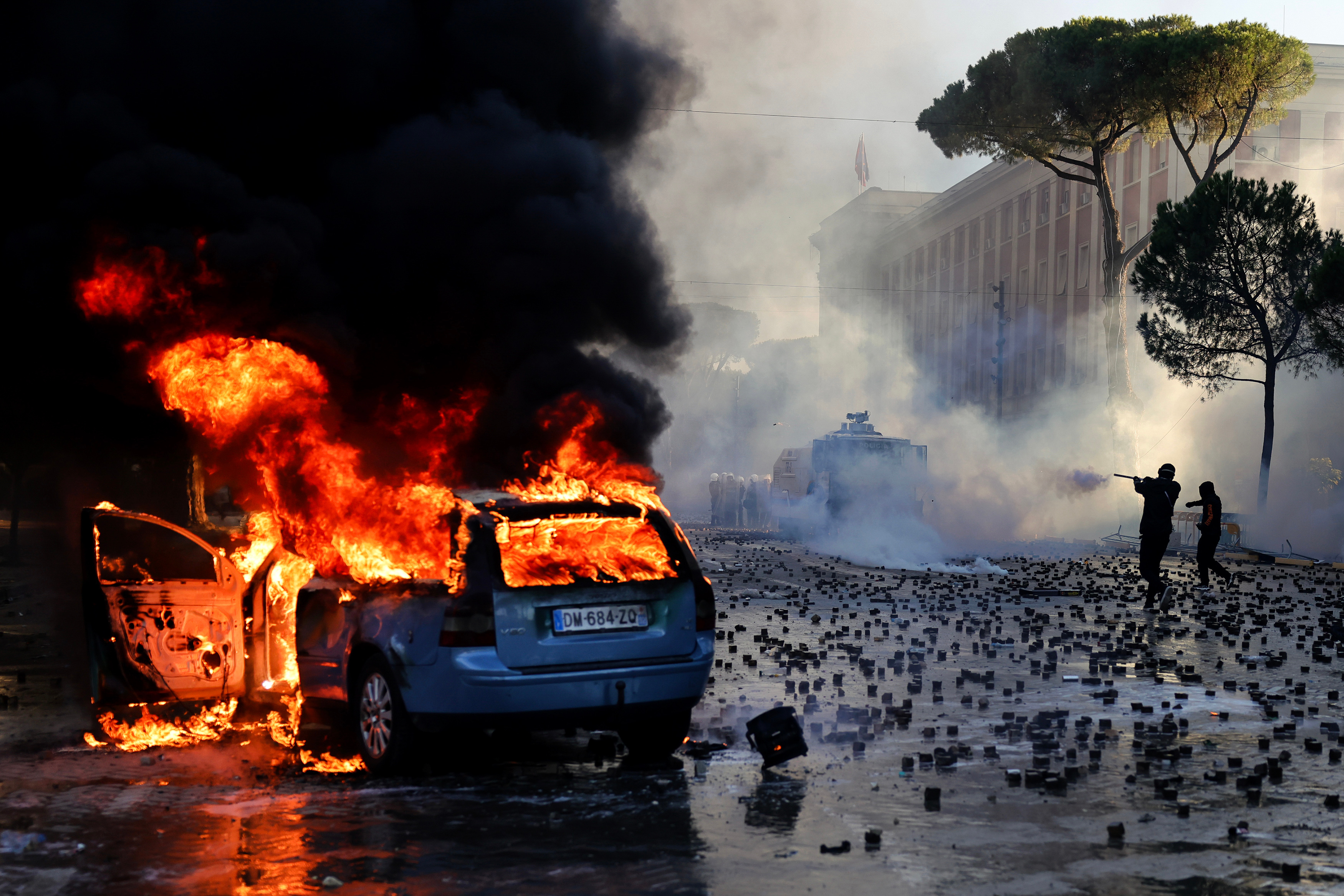 A car burns as clashes erupted during an anti-government demonstration outside the prime minister’s office, in Tirana on October 17, 2026