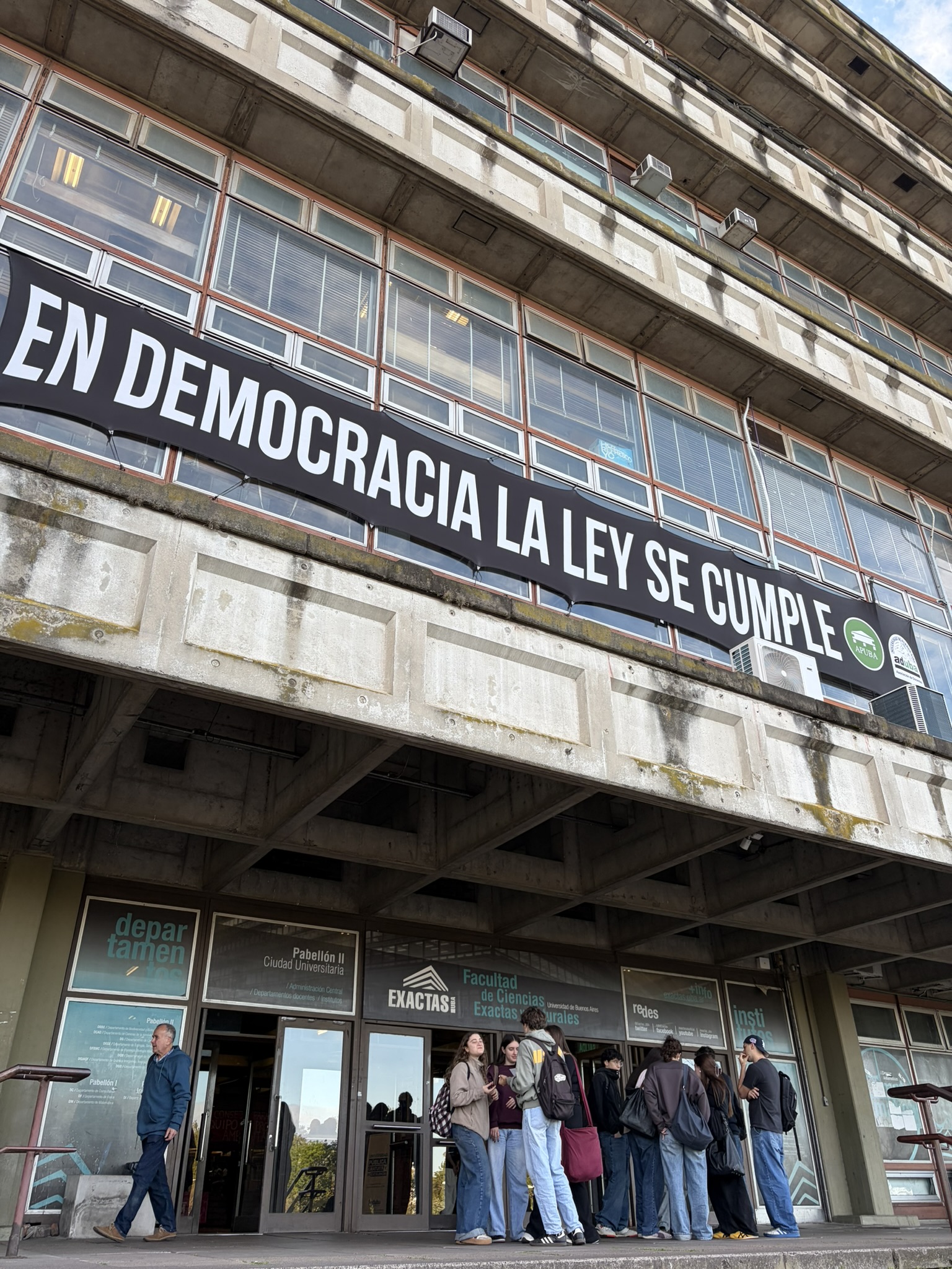 A banner at a university in Buenos Aires reads "In a democracy, the law is upheld." [Lagmi Chavez / Al Jazeera]