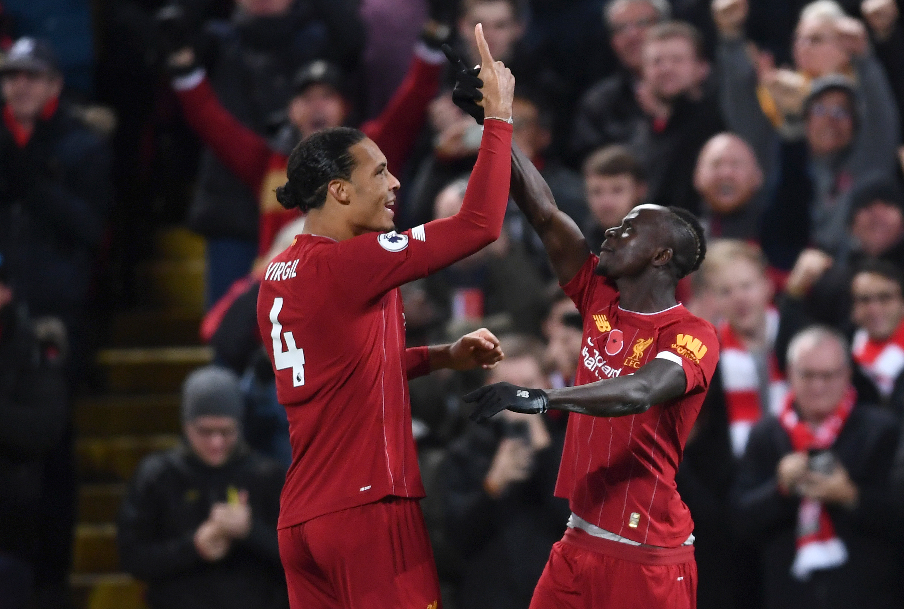LIVERPOOL, ENGLAND - NOVEMBER 10: Sadio Mane of Liverpool celebrates after scoring his team's third goal with teammate Virgil van Dijk during the Premier League match between Liverpool FC and Manchester City at Anfield on November 10, 2019 in Liverpool, United Kingdom. (Photo by Laurence Griffiths/Getty Images)