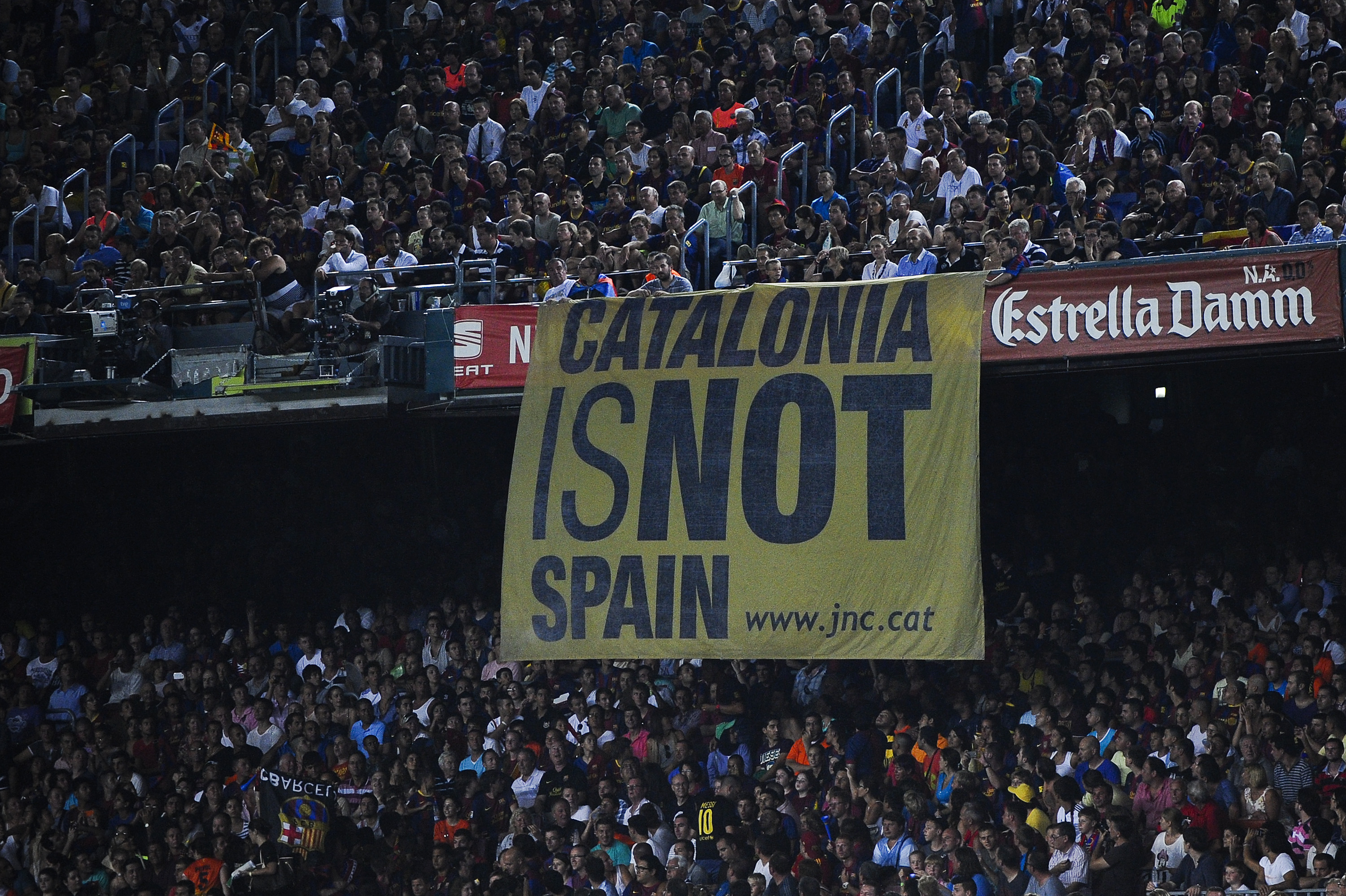 BARCELONA, SPAIN - AUGUST 23: A banner that reads 'Catalonia is not Spain' is displayed in the stand during the Super Cup first leg match between FC Barcelona and Real Madrid at Camp Nou on August 23, 2012 in Barcelona, Spain. (Photo by David Ramos/Getty Images)